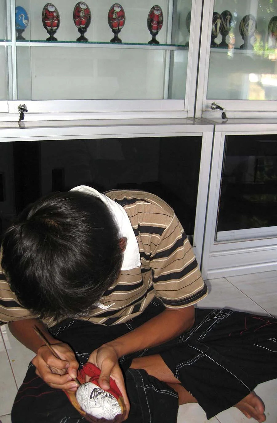 painting the wooden egg.jpg