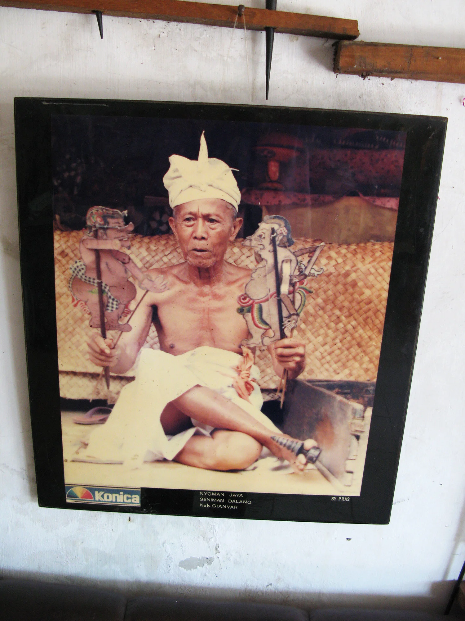 A photograph of a Dalang, a highly skilled shadow puppet performer