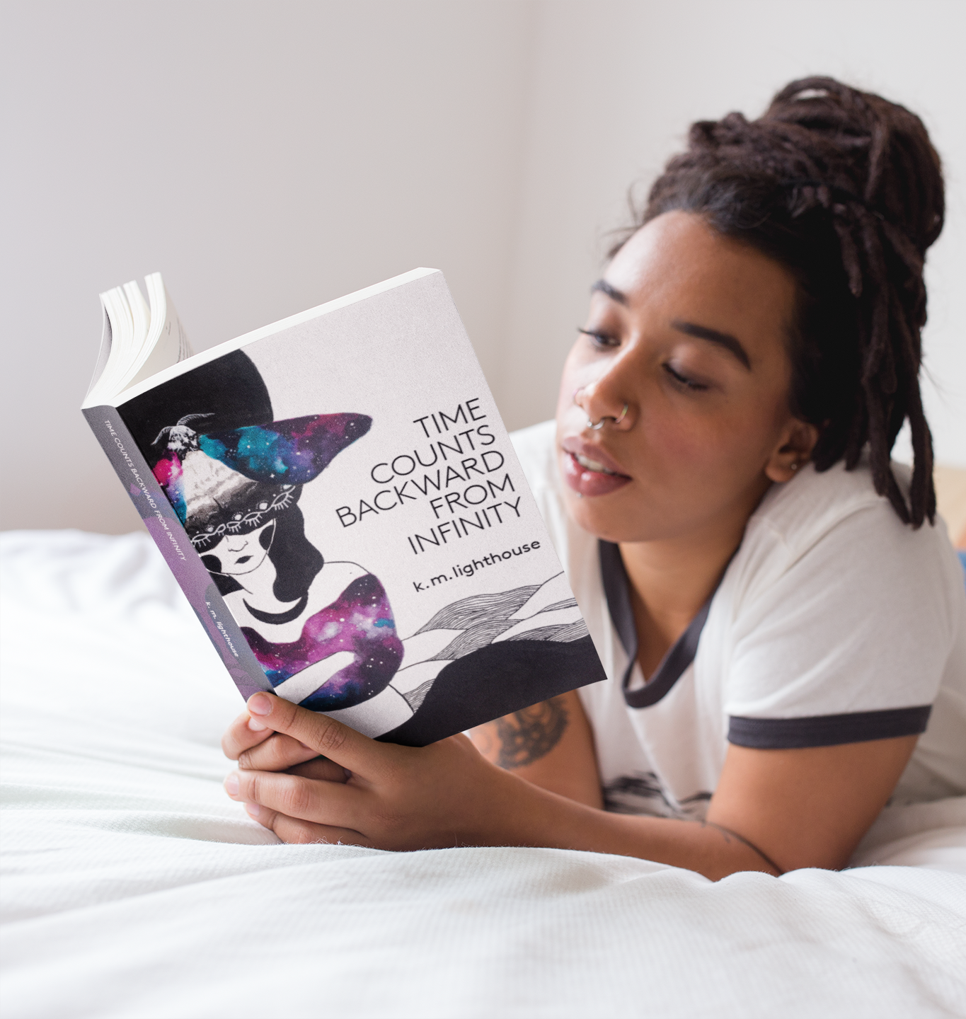 mockup-of-a-woman-with-locs-reading-a-book-in-bed-a17302.png