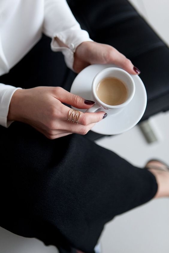 Drinking tea or coffee close up on cup