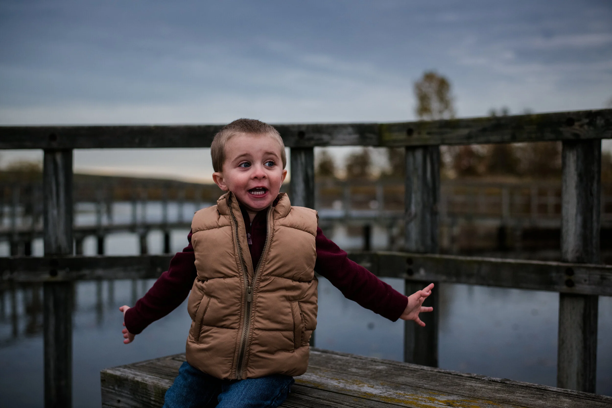 Candid photo of a happy child enjoying an outdoor family hike during a session with Forever Ago Photography. Capturing authentic moments of joy, connection, and adventure in Crosswinds Marsh Wayne, Michigan