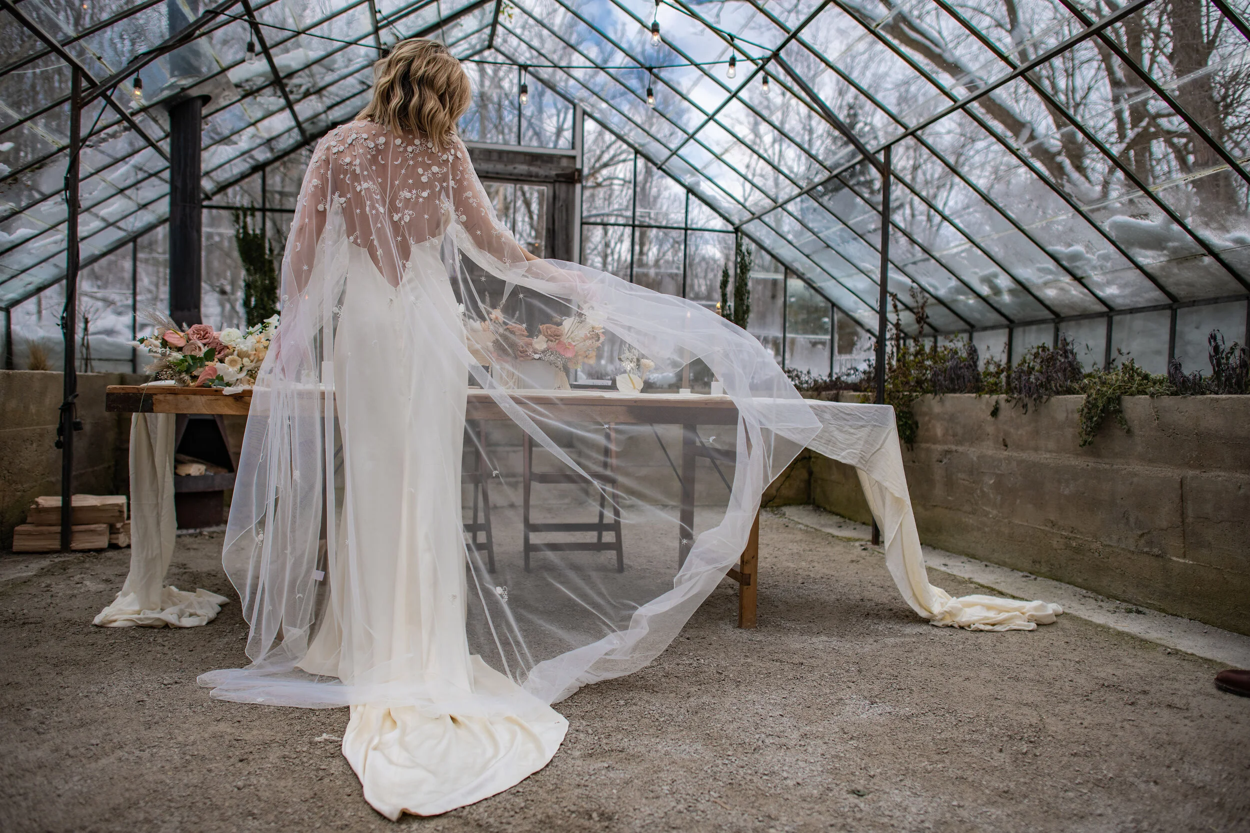 Elegant photo of a bride wearing a beautiful cape, captured during a wedding photography session by Forever Ago Photography in Wayne Michigan. Highlighting timeless style and bridal elegance."