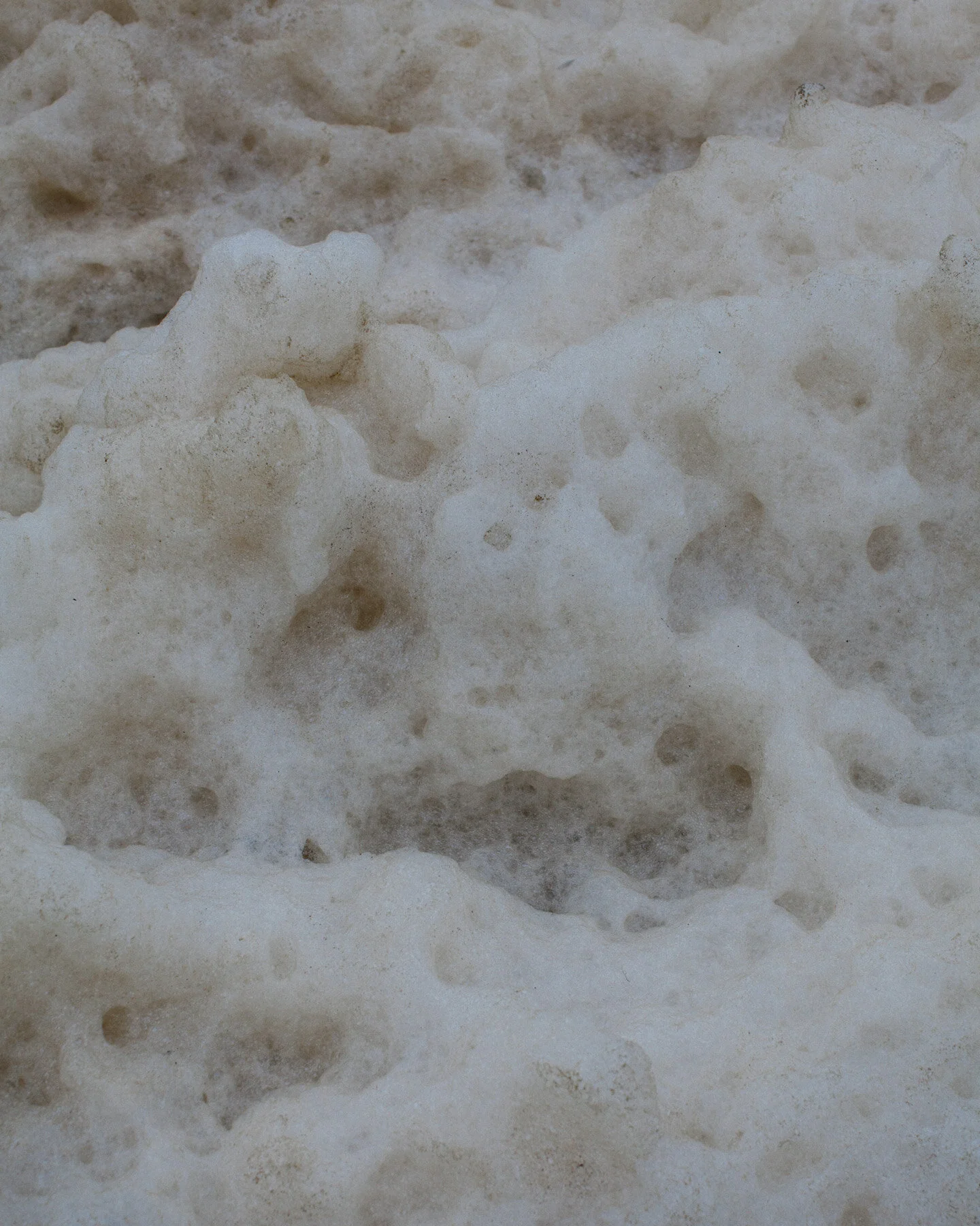 Sea foam residue left by the waves.