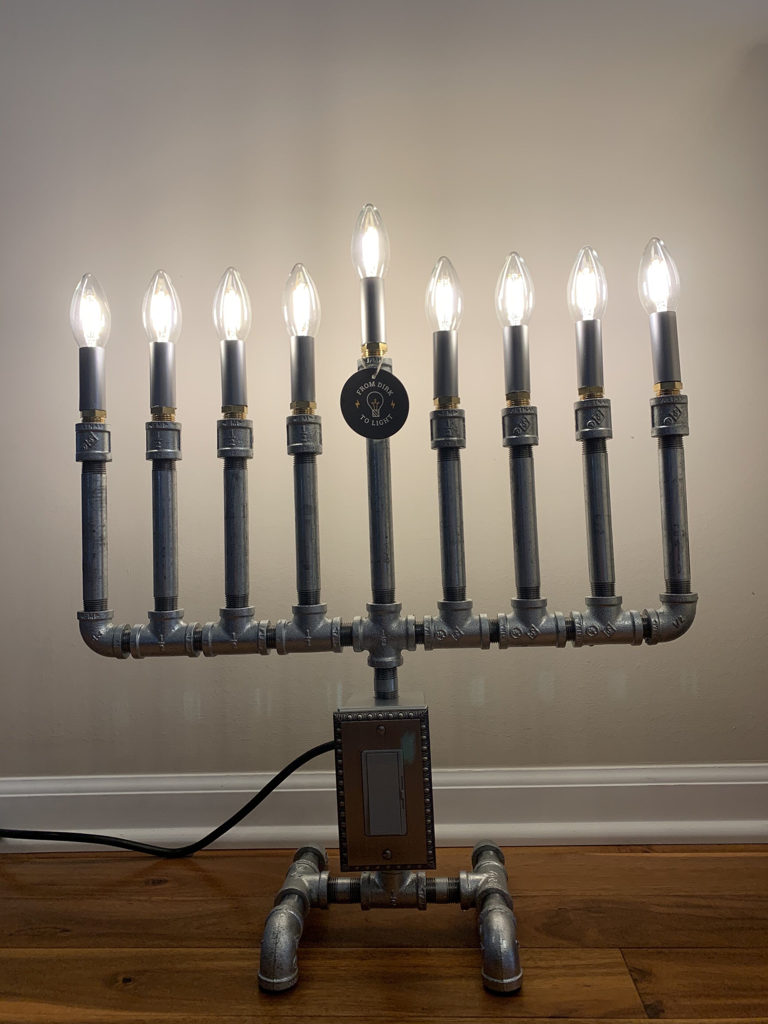 Steampunk Menorah that is dimmable. This item is available for purchase. You can simply unscrew the LED bulbs and screw them in for each day of Hanukkah. This is made to order in the shop now.