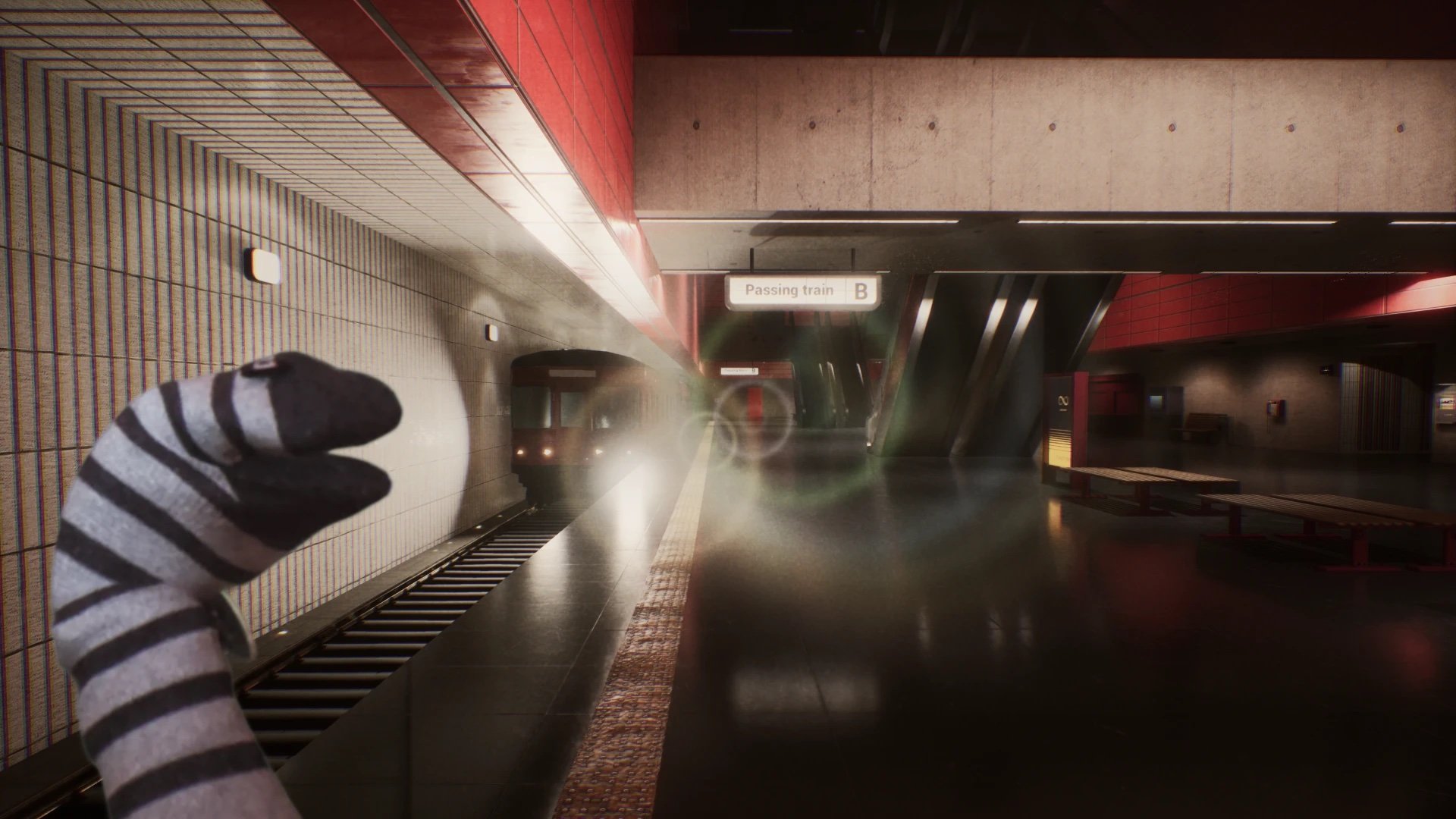 Transit game screenshot: a striped sock puppet watches a train arrive at a red-tiled metro platform