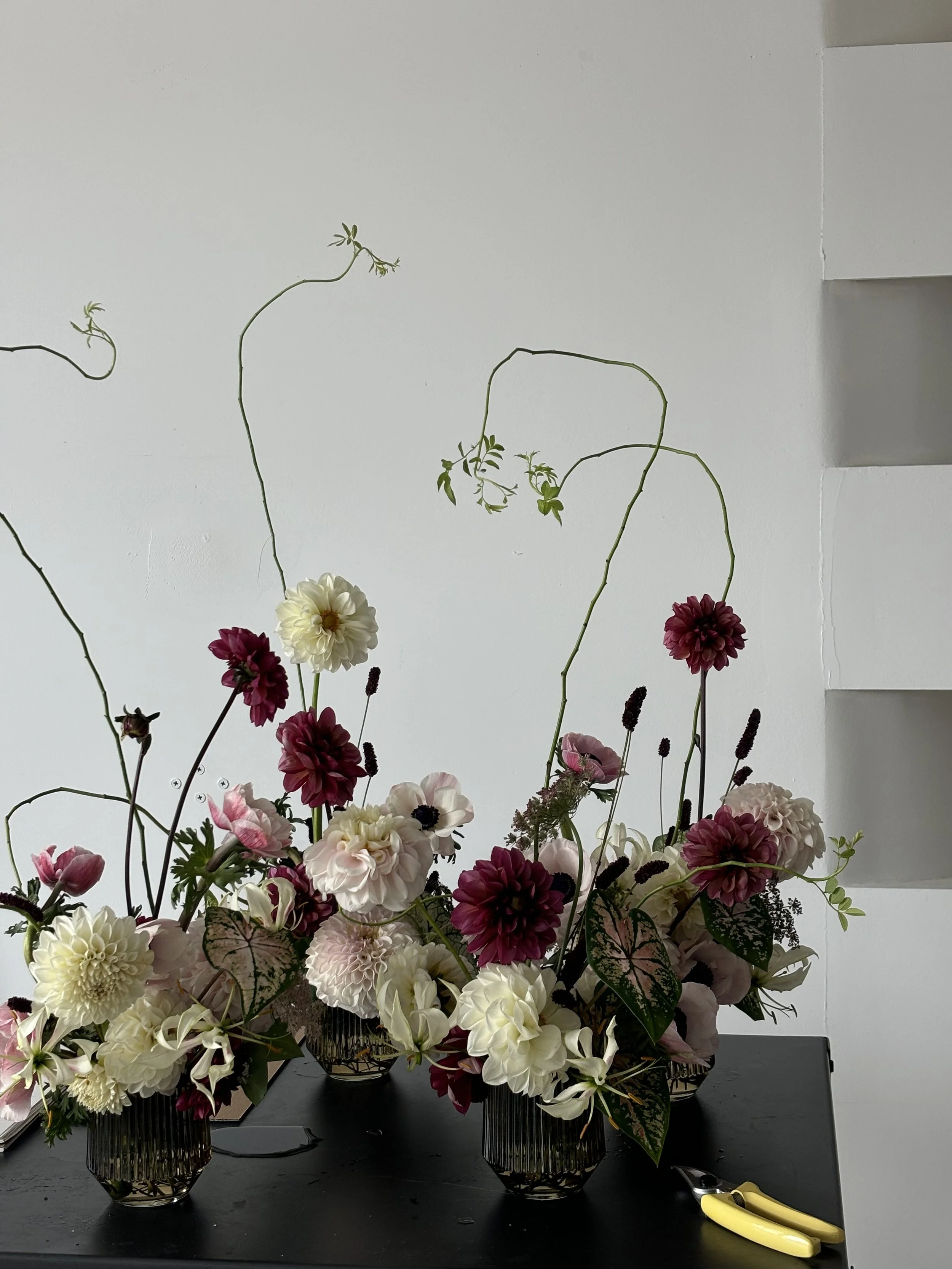 Sculptural floral centerpiece with seasonal blooms