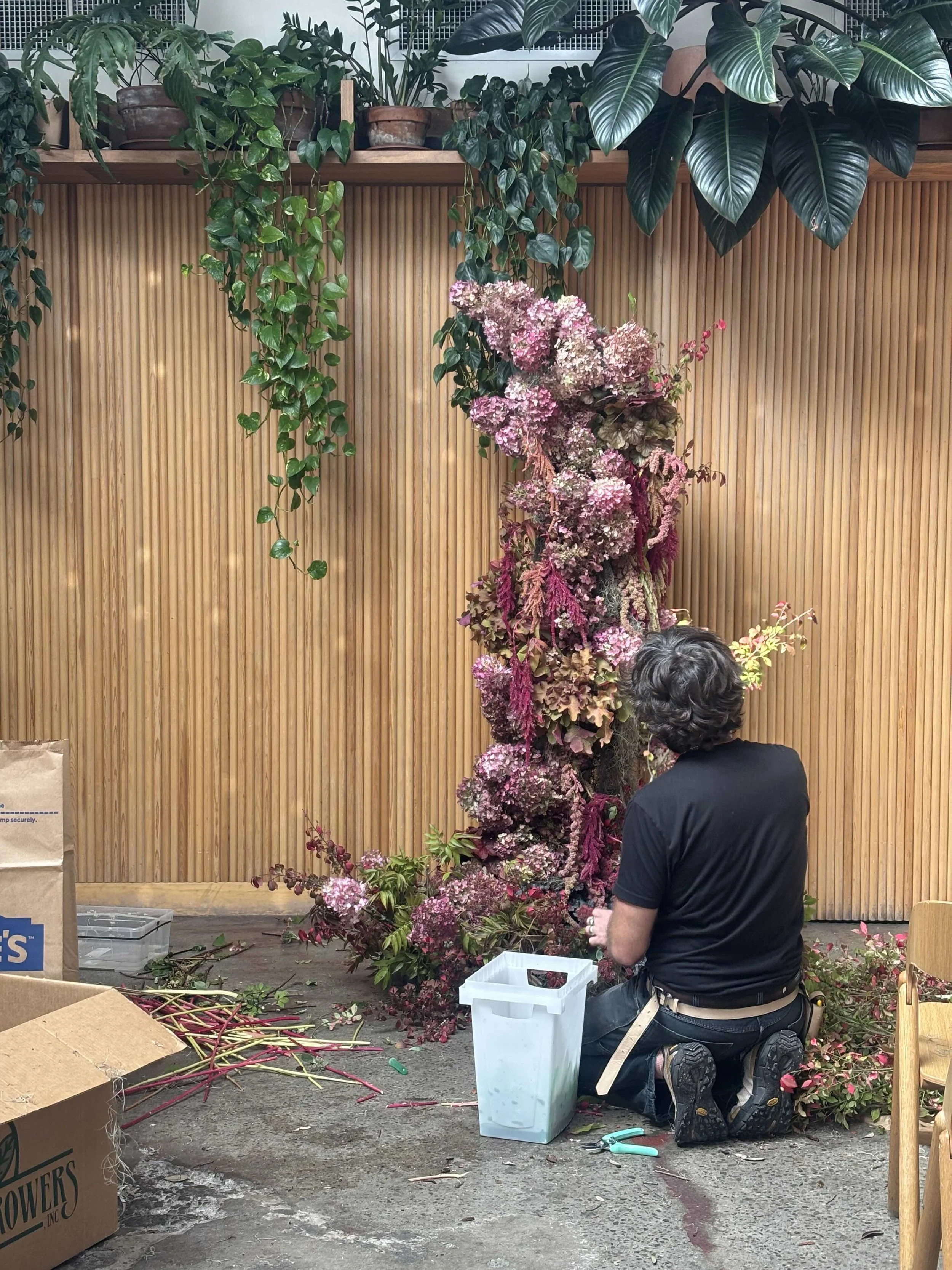 Floral designer creating an installation