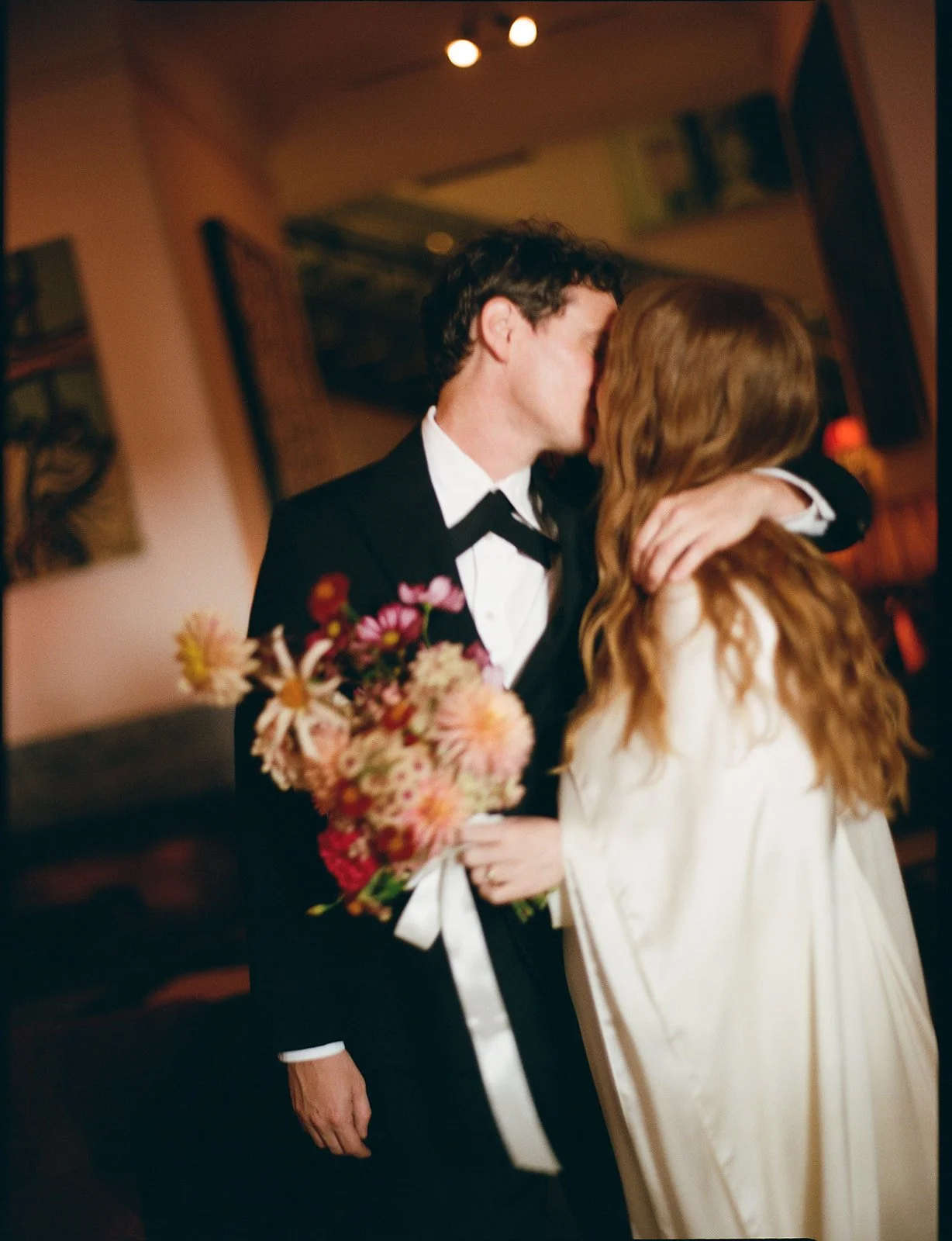 Couple embracing at a wedding reception
