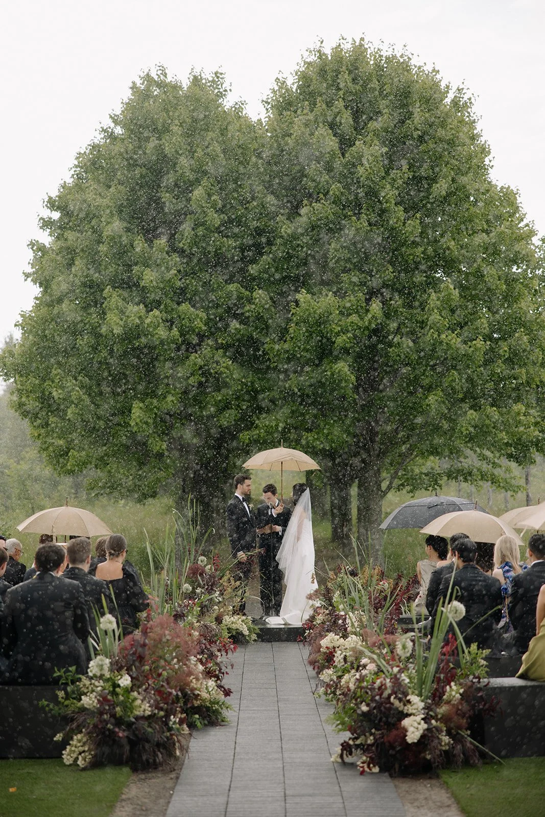 Outdoor wedding ceremony florals at Wildflower Farms in Upstate New York