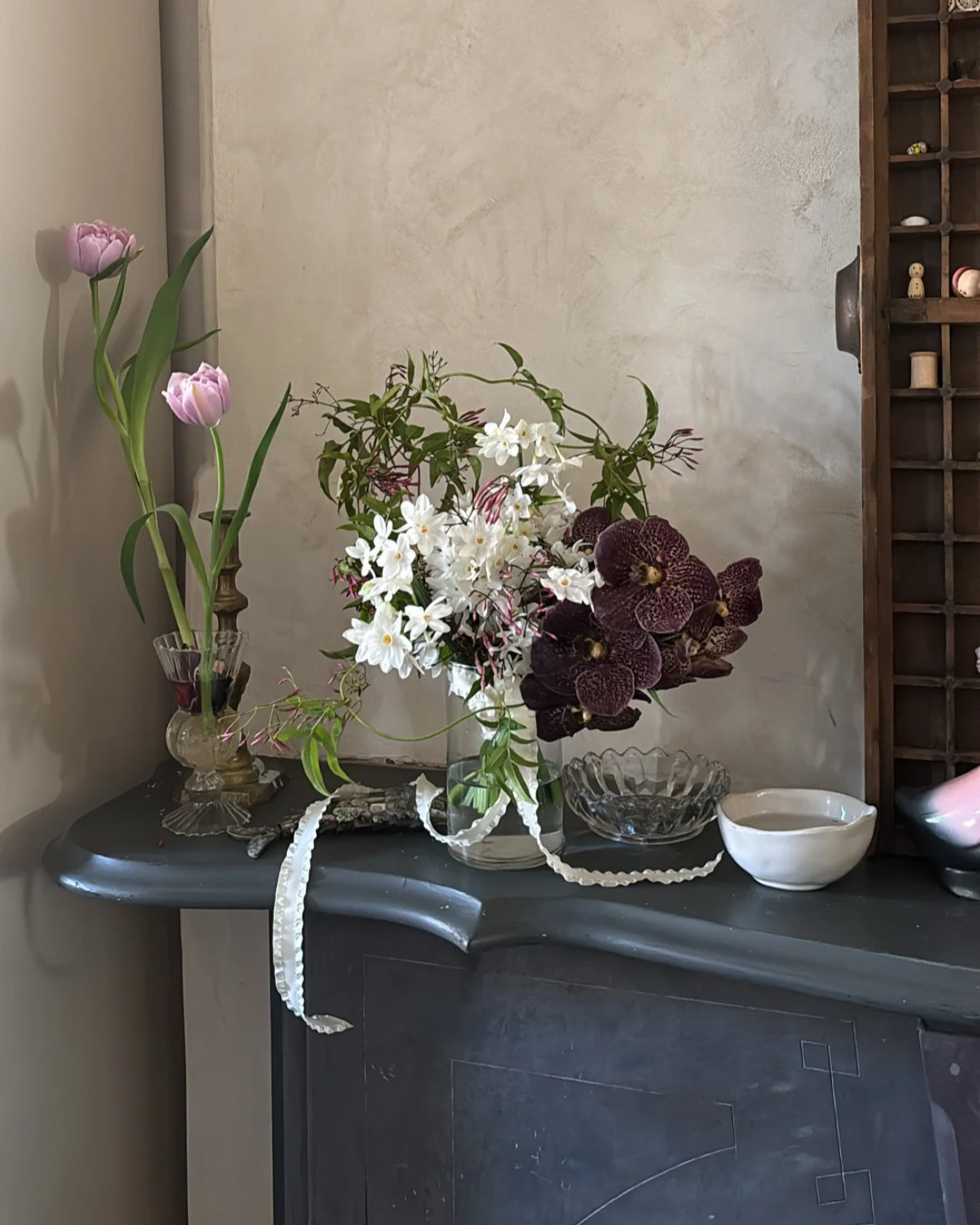 Contemporary floral arrangement displayed on a mantel