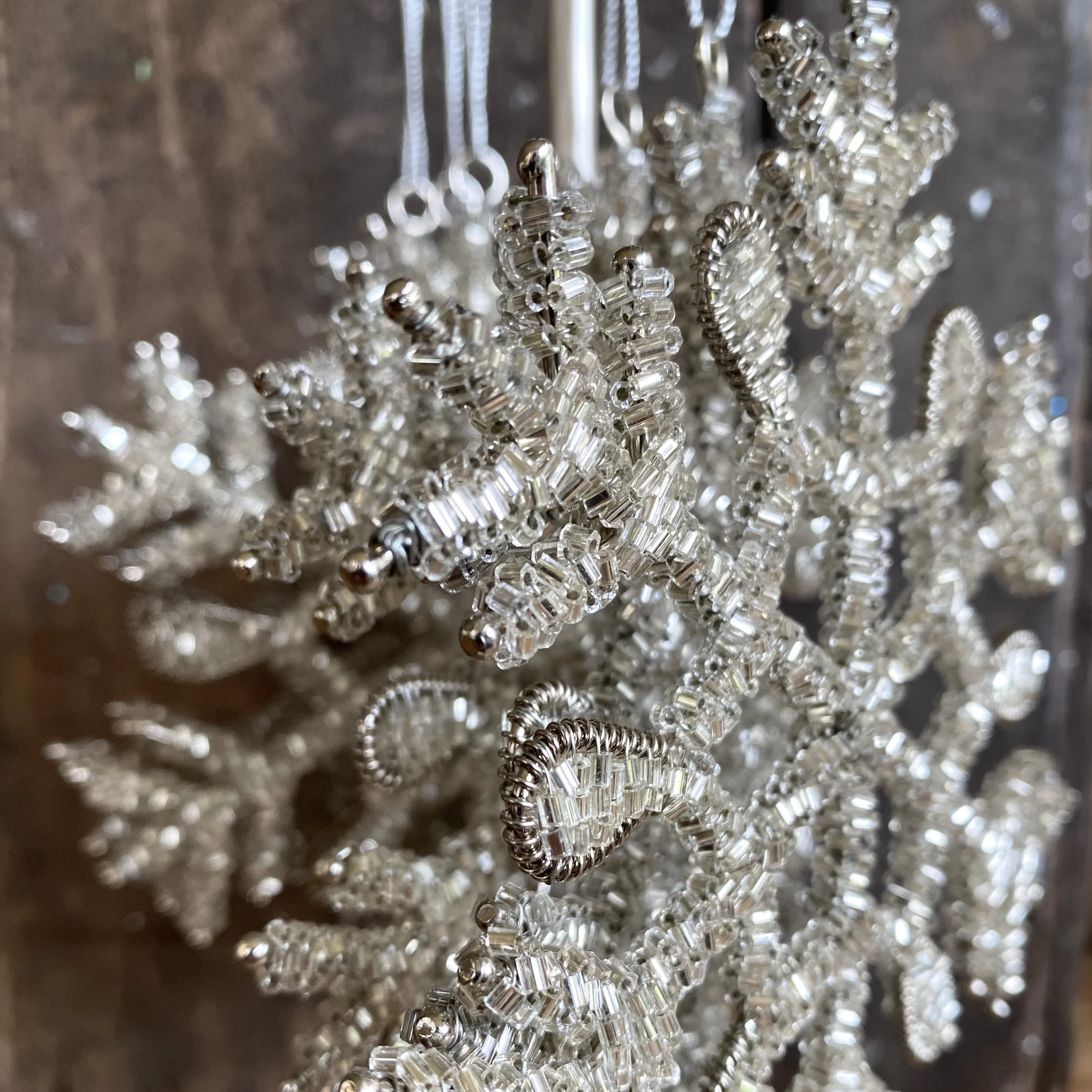 Snowflake ornaments sparkle in the light. Available in Pittsburgh and nationwide shipping!