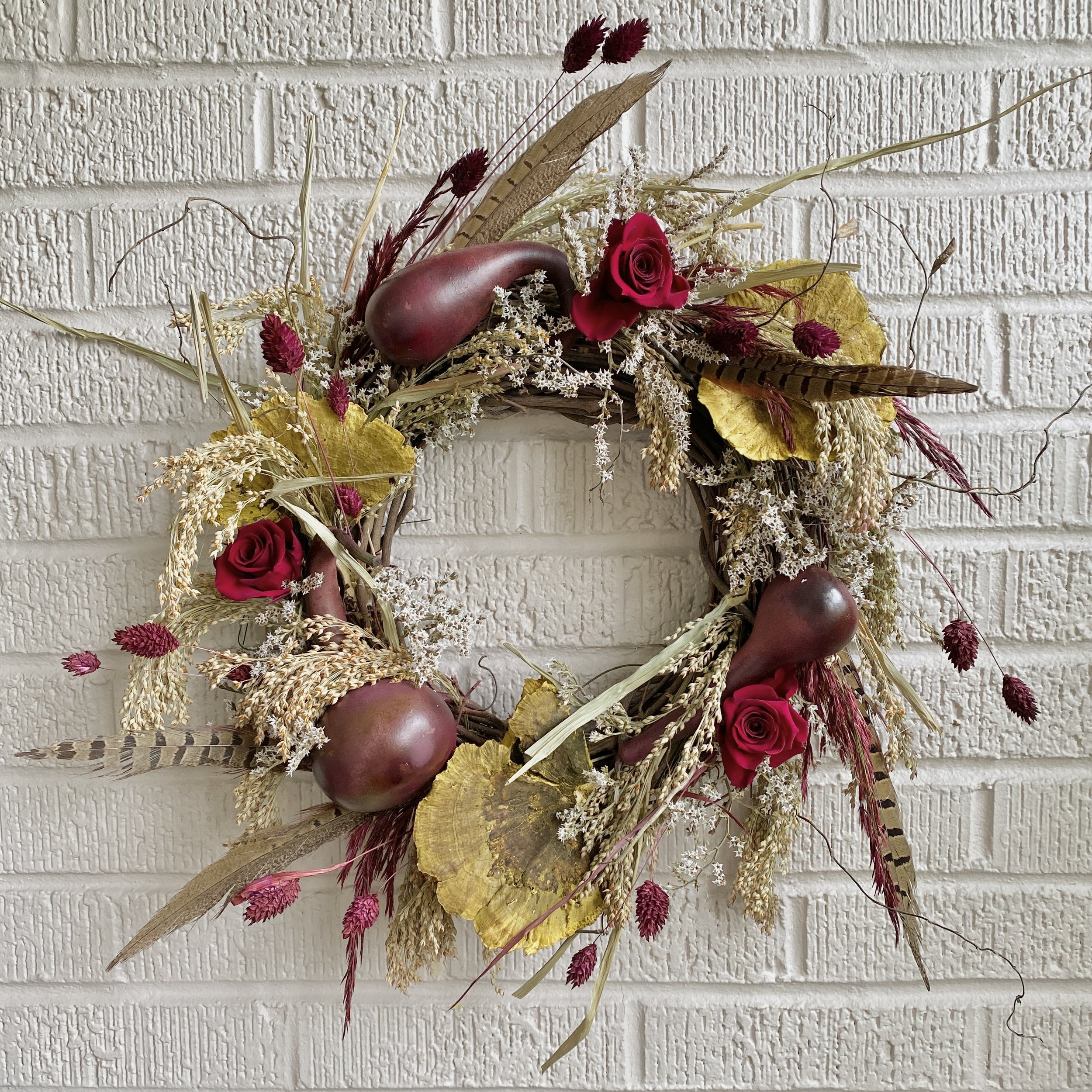 Elegant Autumn Wreath with Feathers and Gourds