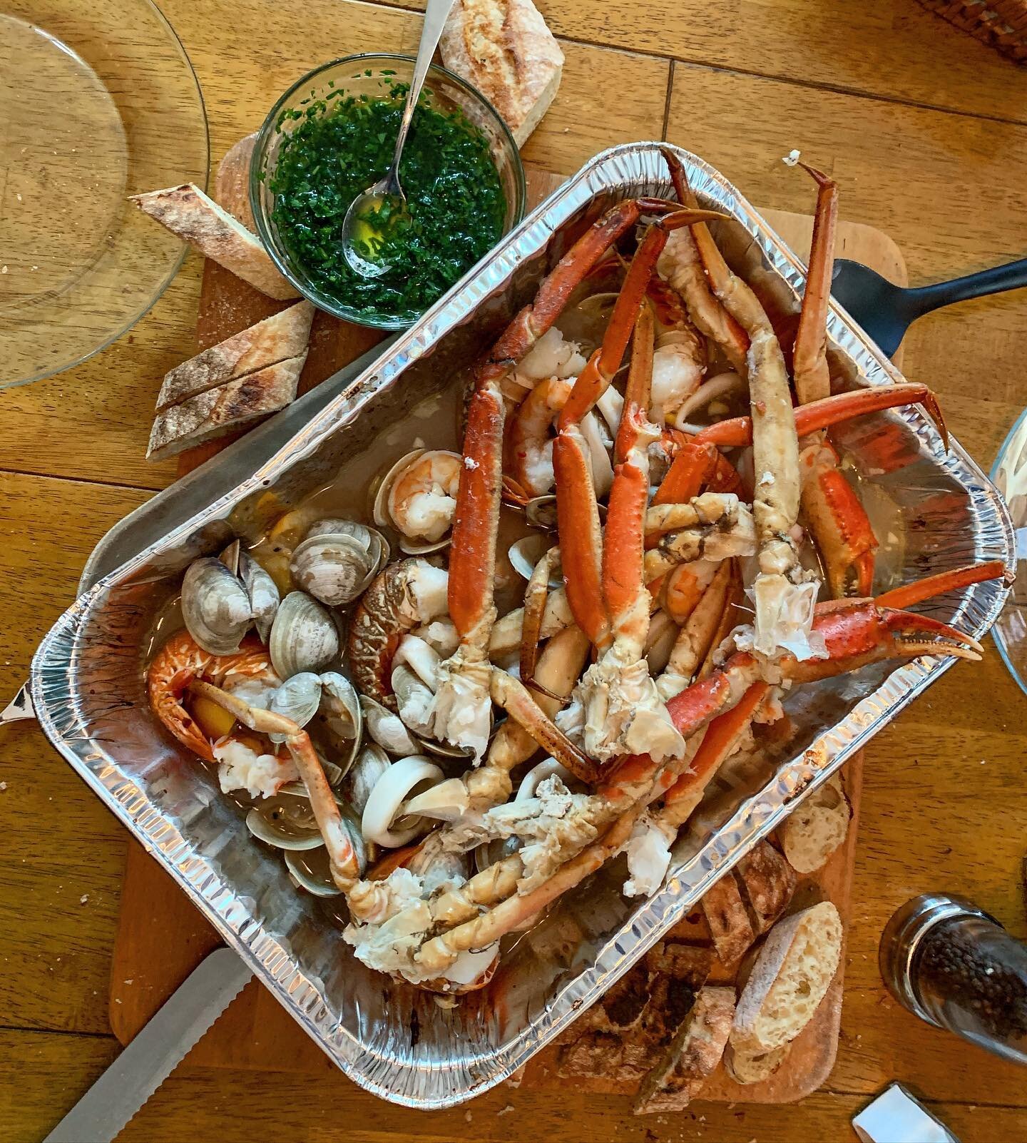 My mom loves seafood, so this is what I made for her tonight. Clams, lobster tails, snow crab legs, squid, and shrimp with chimichurri and crusty bread. She loved it and I love making her happy ❤️ 
Happy Mother&rsquo;s Day to all who celebrate! 
#kit