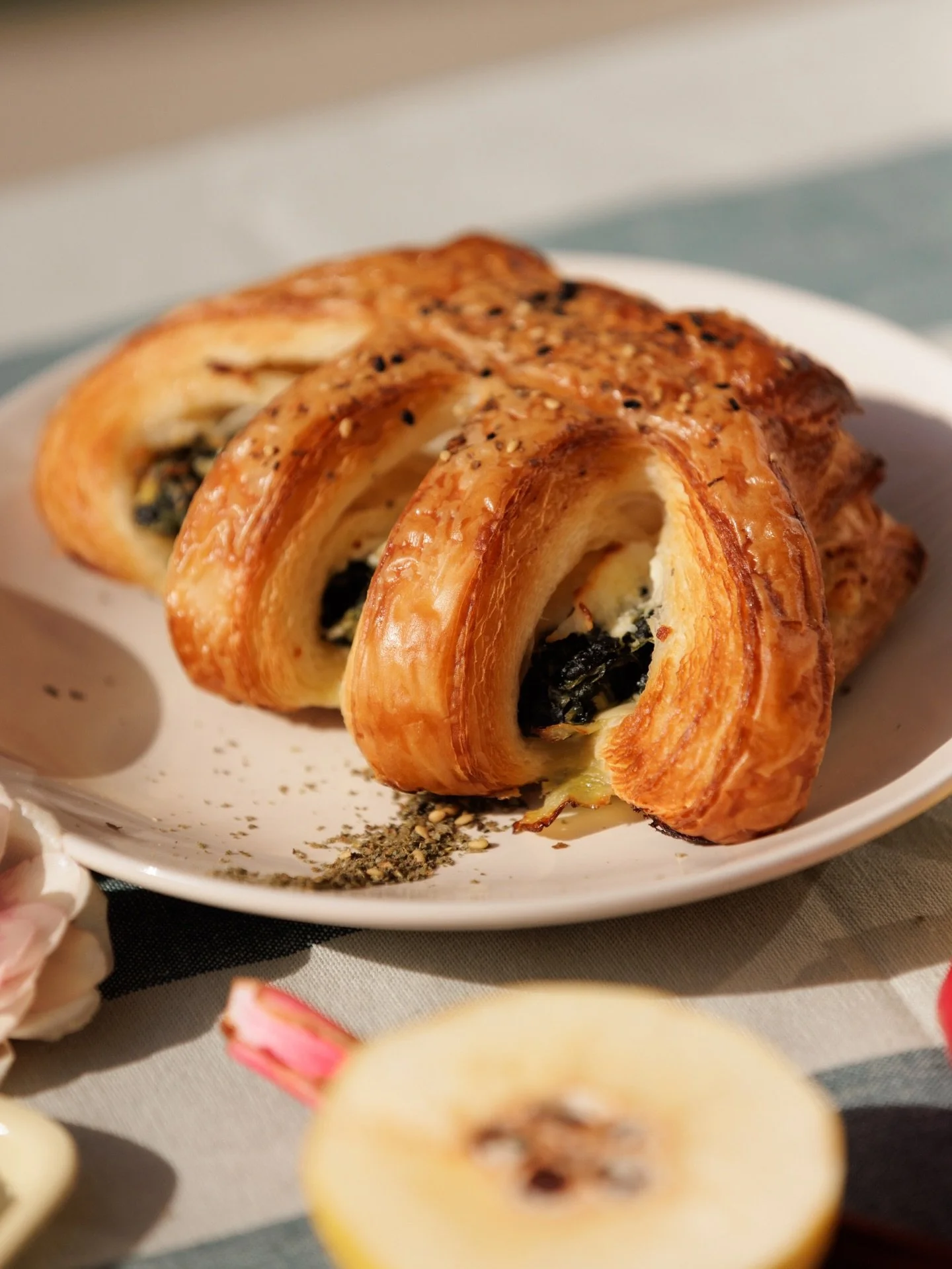the last few weeks of our spring spanakopita bear claw 🐾

herby greens filling (dill, parsley, mint, spinach, lemon zest), feta cheese, egg + zesty lemon ricotta baked in a croissant, garnished with za&rsquo;atar + black sesame!

here until 5/31