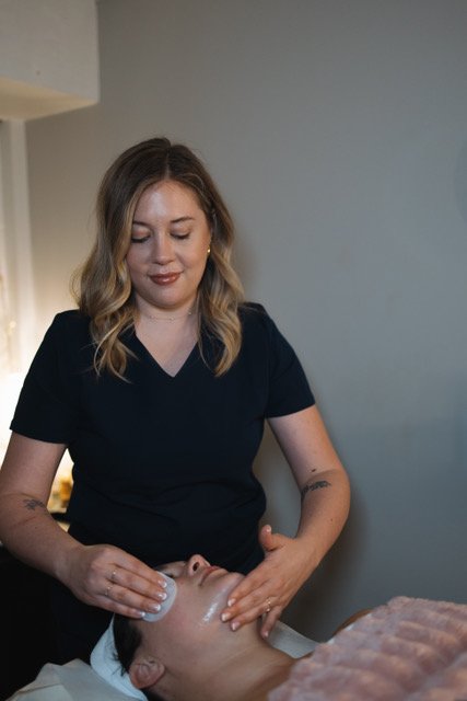 A woman receiving a facial peel at a holistic med spa located in St. Louis Missouri, specializing in Buccal Massage