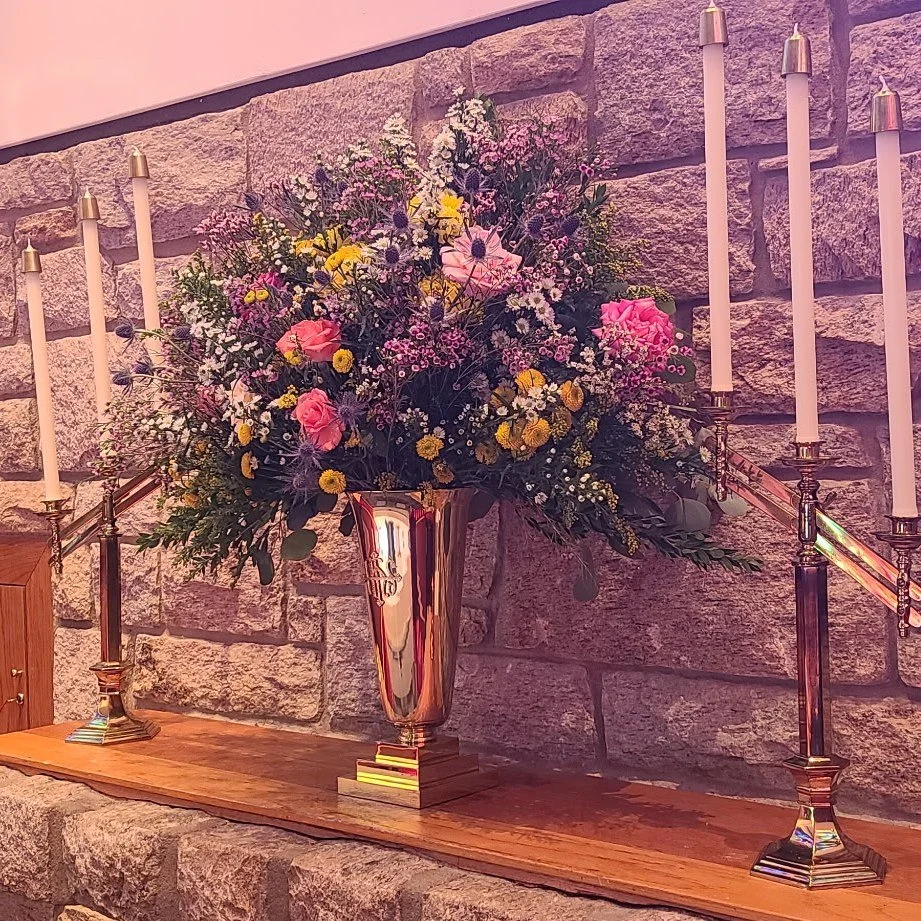 The altar flowers yesterday were given to the glory of God and in memory of Peter B. Bennett.