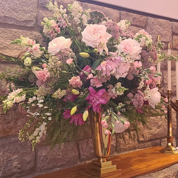 Sunday's altar flowers were given to the glory of God.