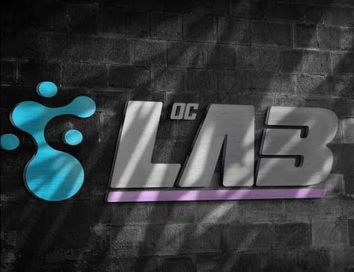 A wall with a graphic logo of blue bubbles and the text 'DC LO3' in metallic letters.