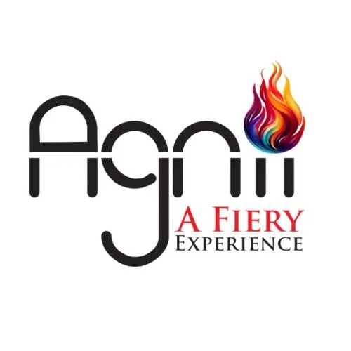 Logo for Agon, a fiery experience, with the word 'Agon' in stylized black letters and a flame with red, orange, yellow, blue, and purple colors above the letter 'n', and the words 'A Fiery Experience' in red and black below.