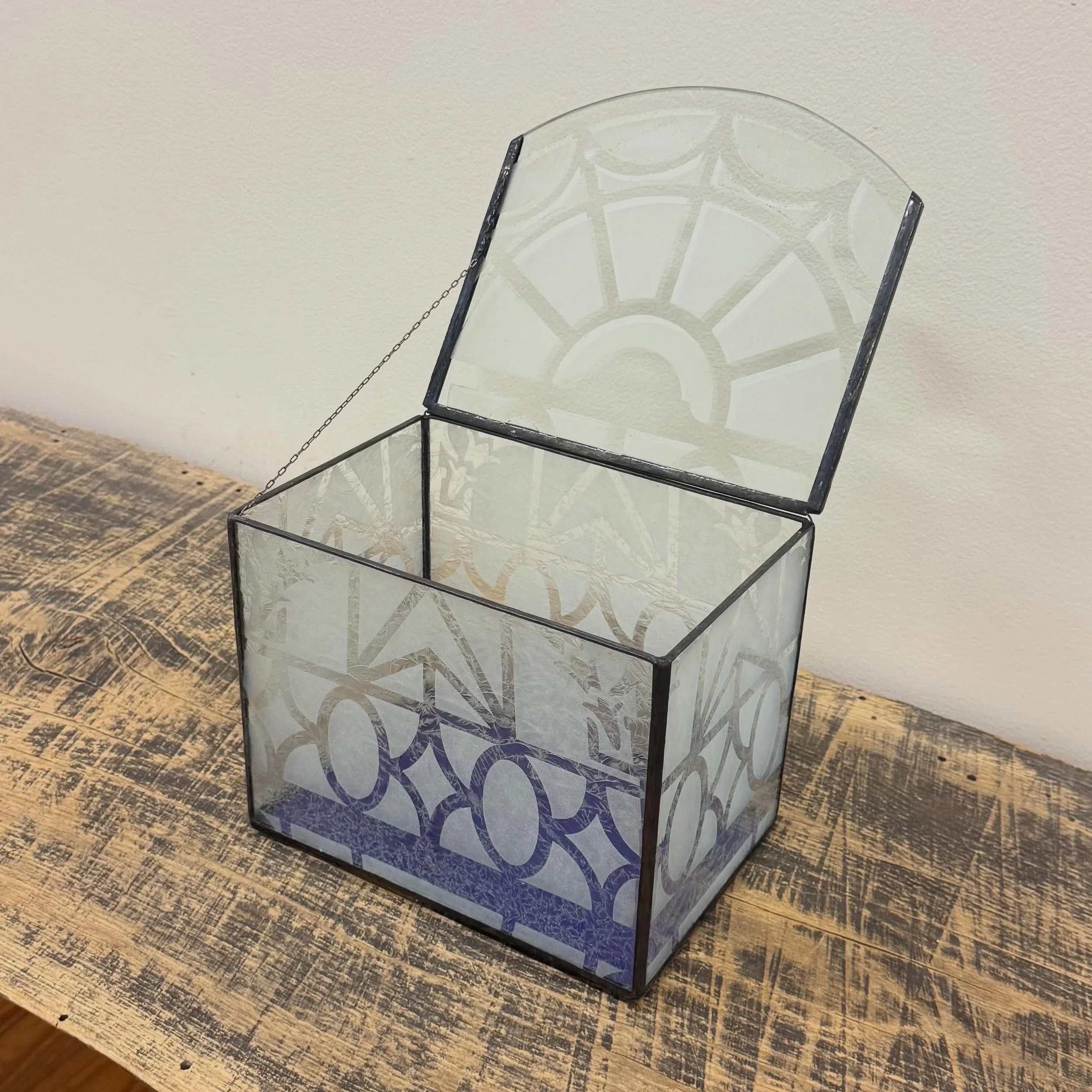 A custom stained glass keepsake box made to hold treasured letters 💜

This piece was created using repurposed etched glass from my alma mater, Central High School &mdash; originally surrounding the auditorium chandeliers. We used purple mirror glass