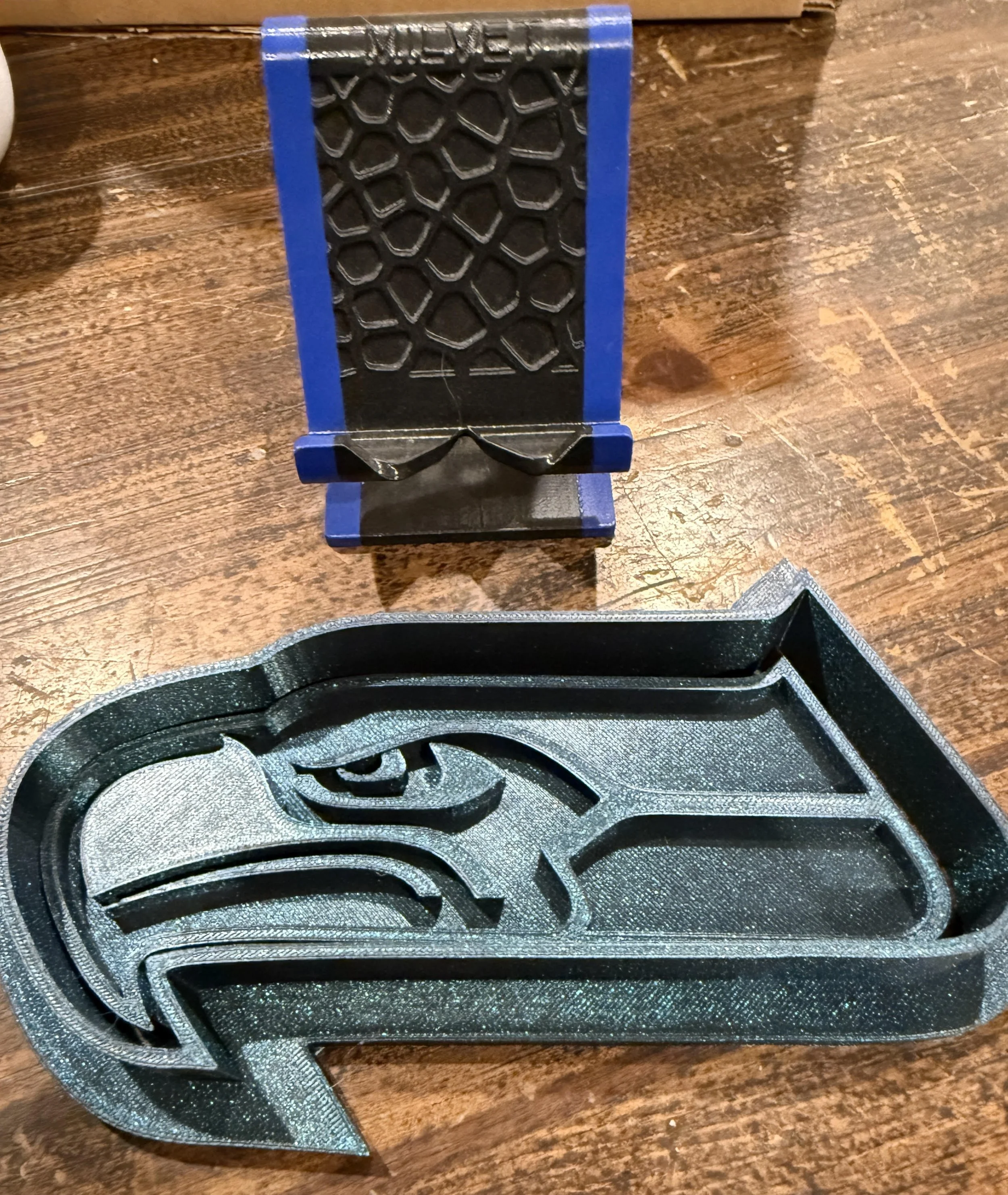 #15 phone stand, #16 seahawks cutter
