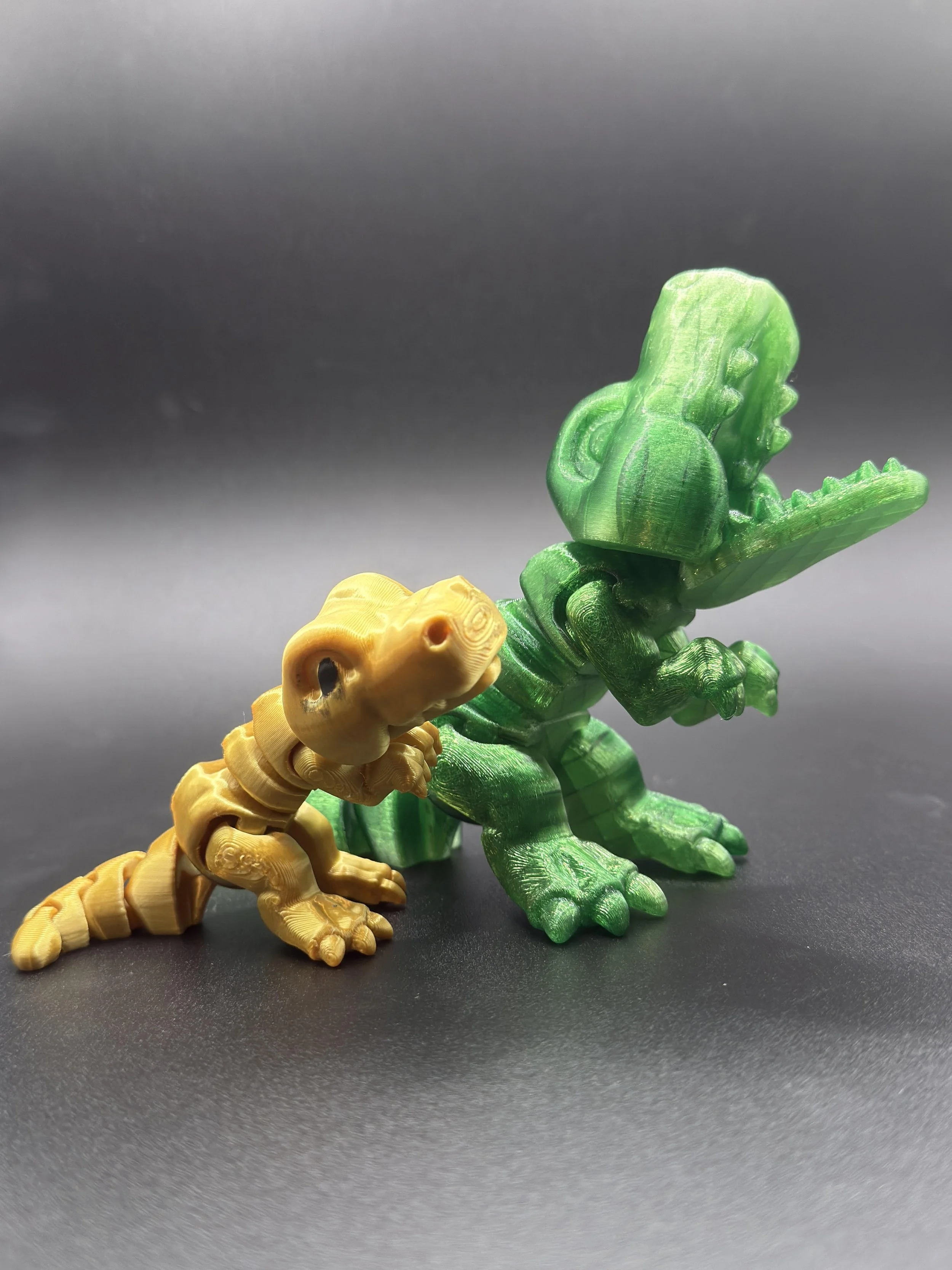 #28 small yellow dino, #29 md green dino