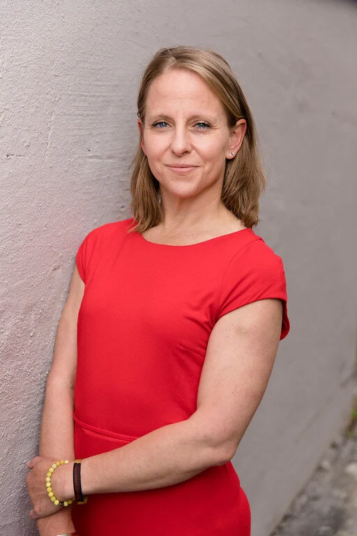 Woman smiling slightly to the camera