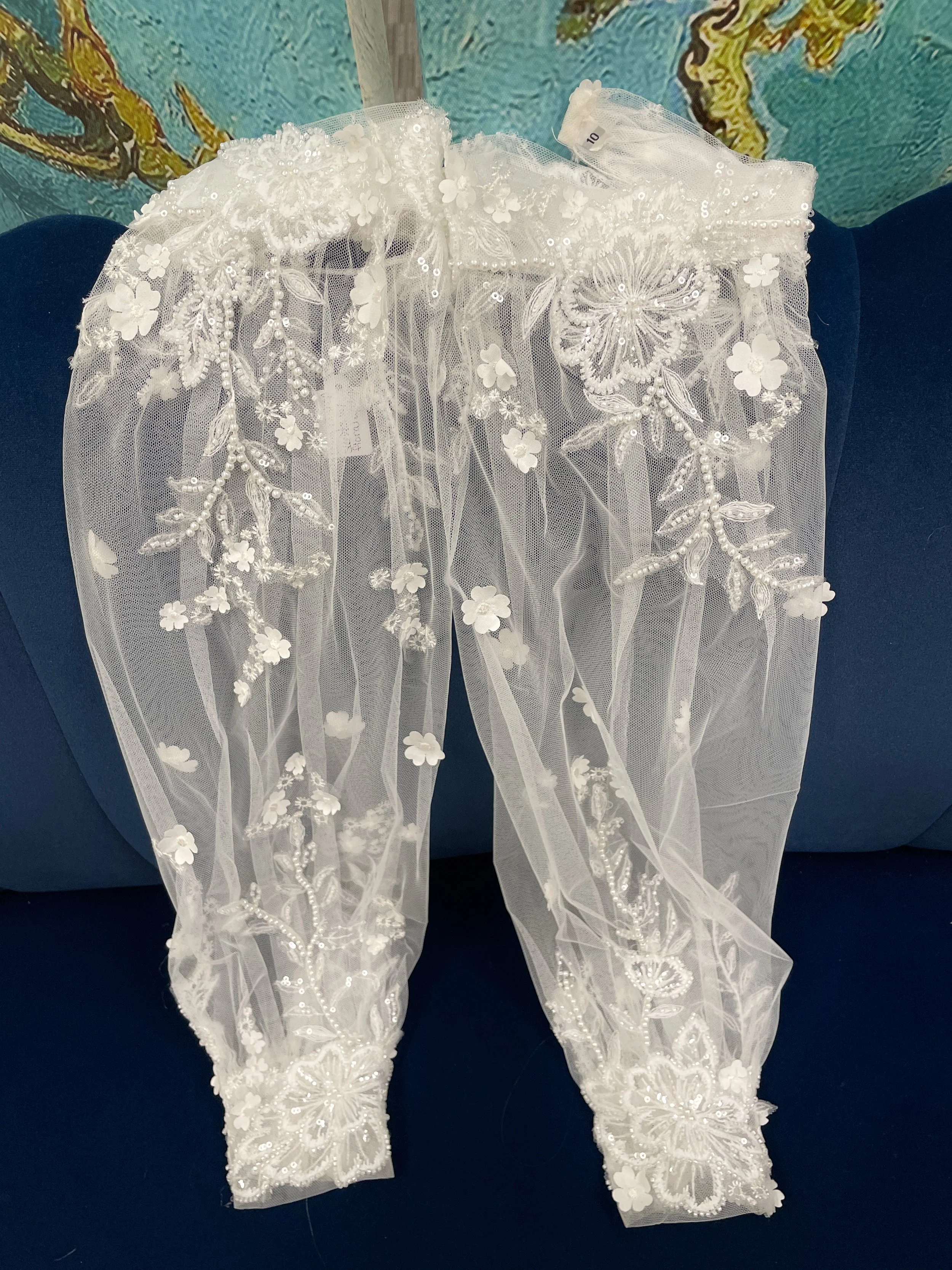 Sleeves:  Long Bishop Sleeves with Floral Appilque and Beading