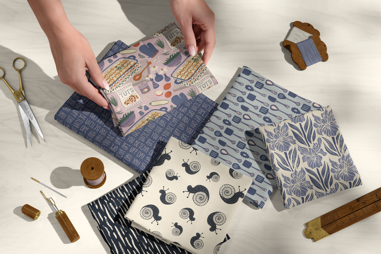 Best-selling fabric prints including kitchen tools, snail, and abstract patterns in navy, blue, and cream