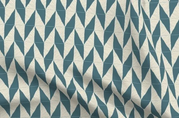 Close-up of chevron herringbone fabric in teal and cream