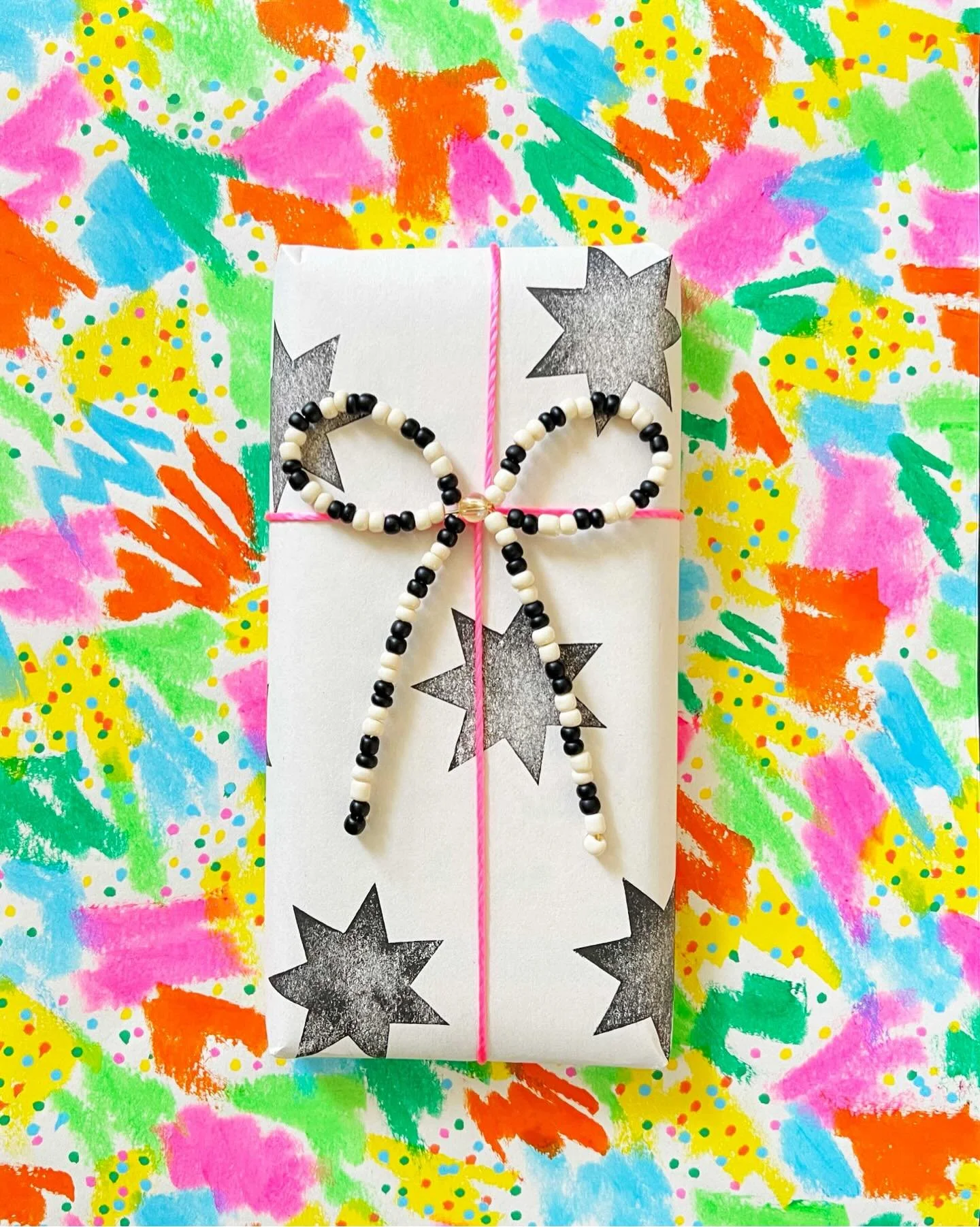 🤍🖤🩷🧡💛💚🩵

Hand-painted and hand-stamped gift wrap. I used tempera paint sticks for the colorful print, and a very basic dye-based ink pad for the stamp (dye-based inks dry quickly and don&rsquo;t smudge, unlike pigment-based inks).