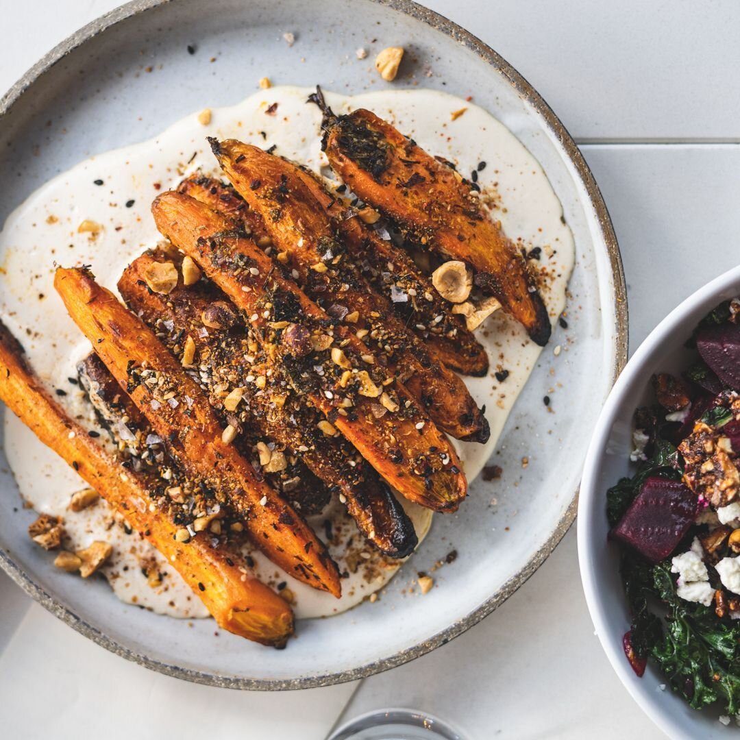 These carrots have been a seasonal staple since they first hit the menu a year or two ago... Whenever carrots are in season you can expect these beauties to be on the menu. They're oven roasted and served over pine nut cream, and topped with chermoul