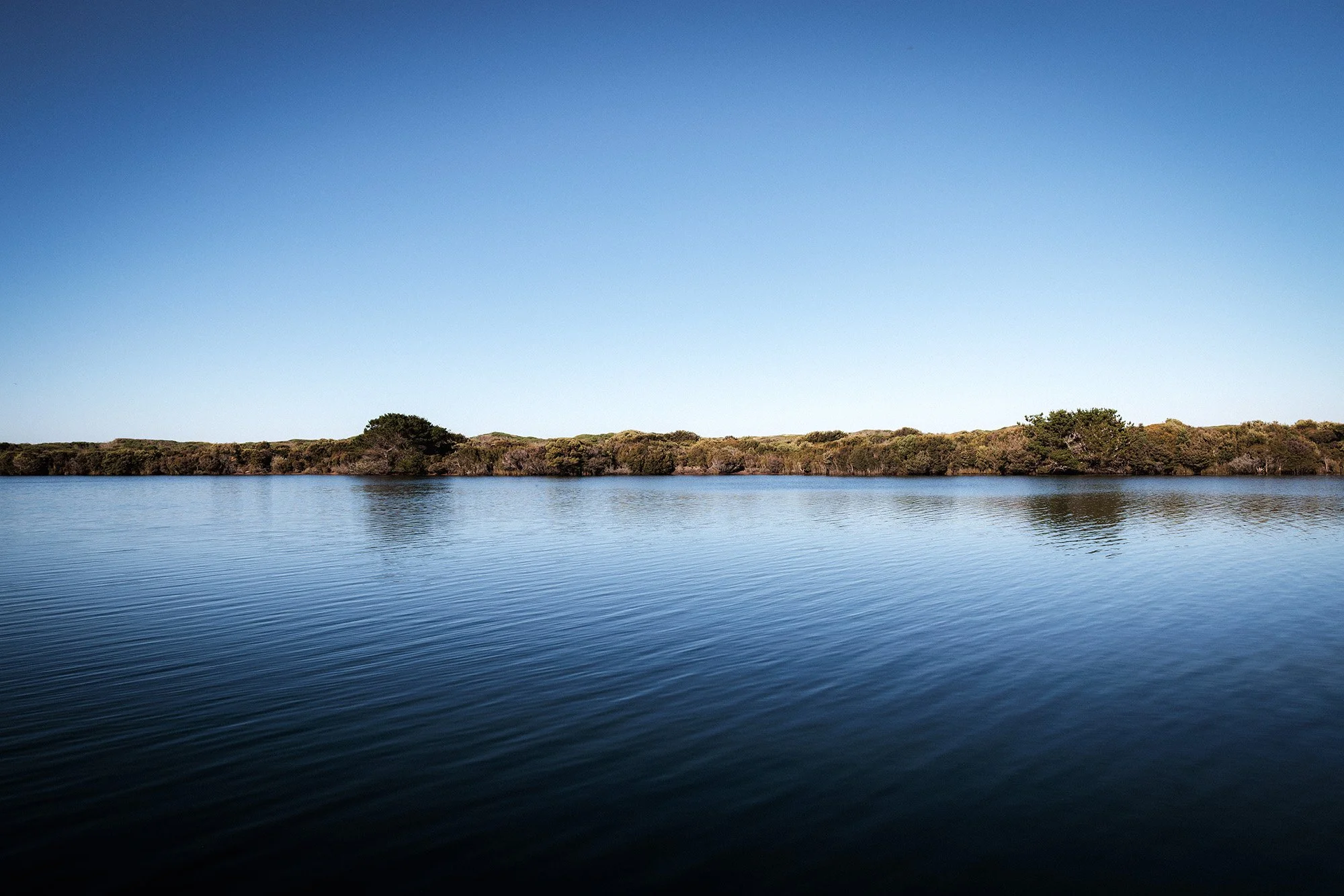 Blue skies and blue water flowing