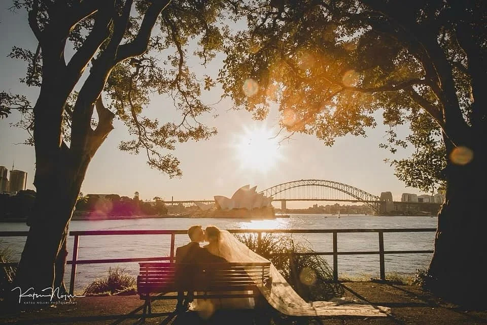 Yes, we ran across the park for this shot… and it was totally worth it. 🌅
Golden hour, Sydney Harbour, and two very loved-up newlyweds — you can’t script moments like this.
.
@katsunojiriphotography 
@facesmakeupandhair 
@chrisste