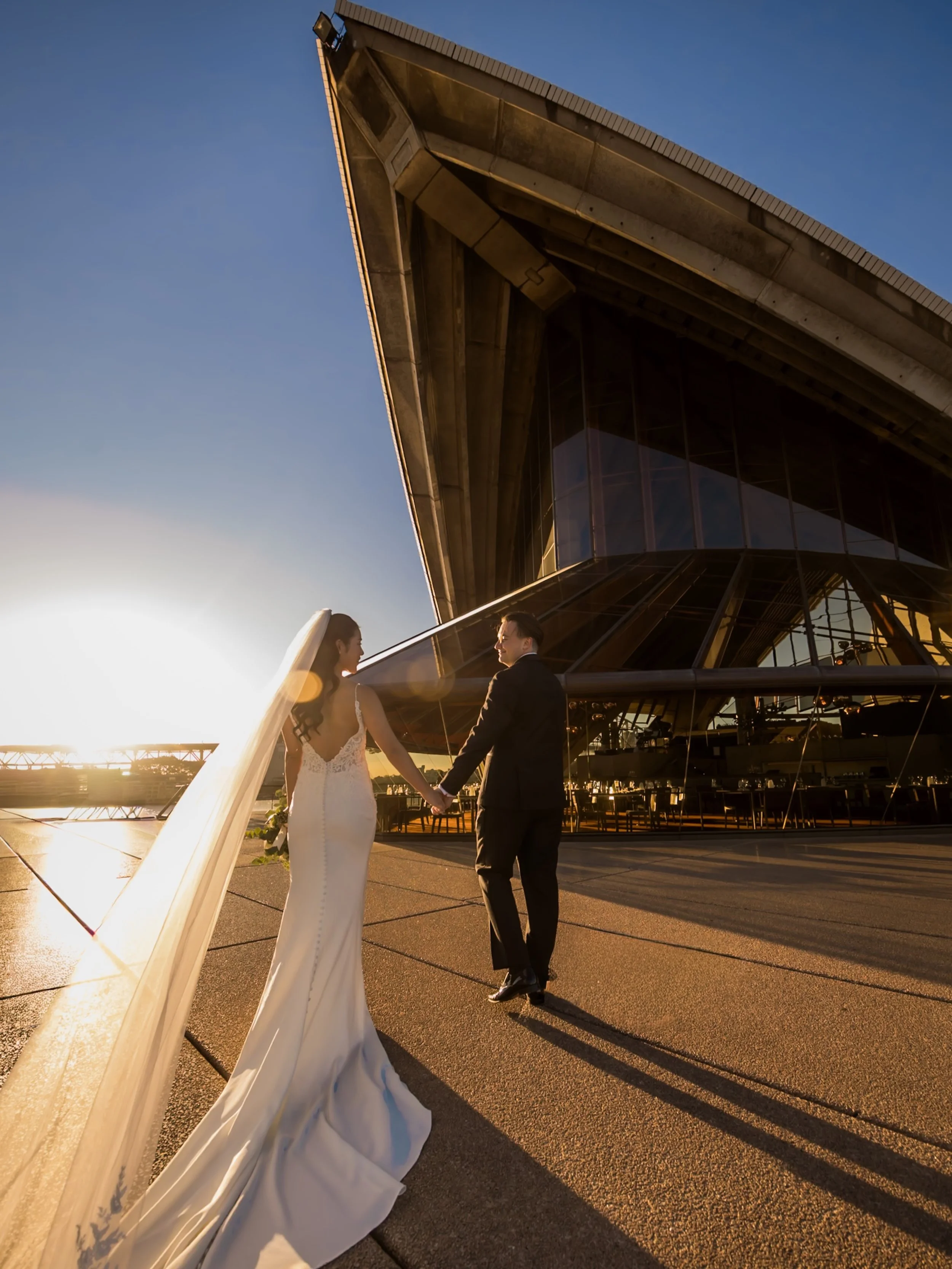 Golden hour at the Sydney Opera House just hits differently ✨
Soft light, harbour breeze, and one very stylish couple making the most iconic Sydney backdrop look even better.

This is why we always recommend scheduling wedding portraits around sunset