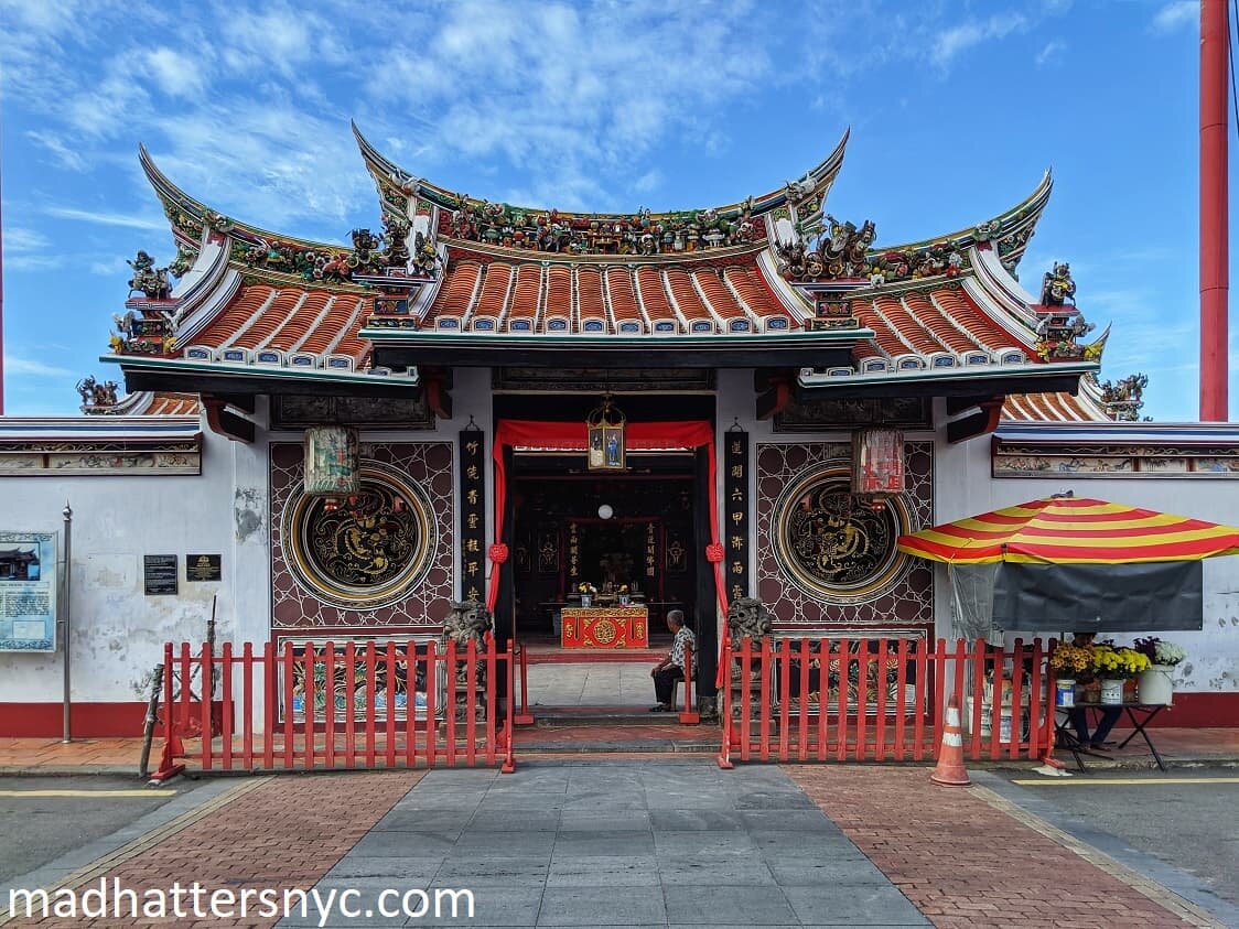 Ornate curved roof and carved dragons at the entrance of Cheng Hoon Teng Temple in Melaka, Malaysia