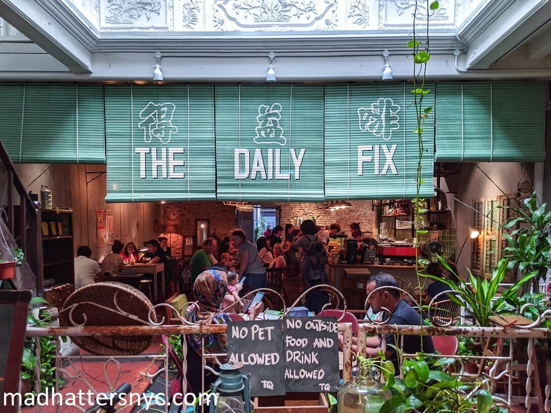 Warm and cozy interior of the Daily Fix Cafe in Melaka, Malaysia