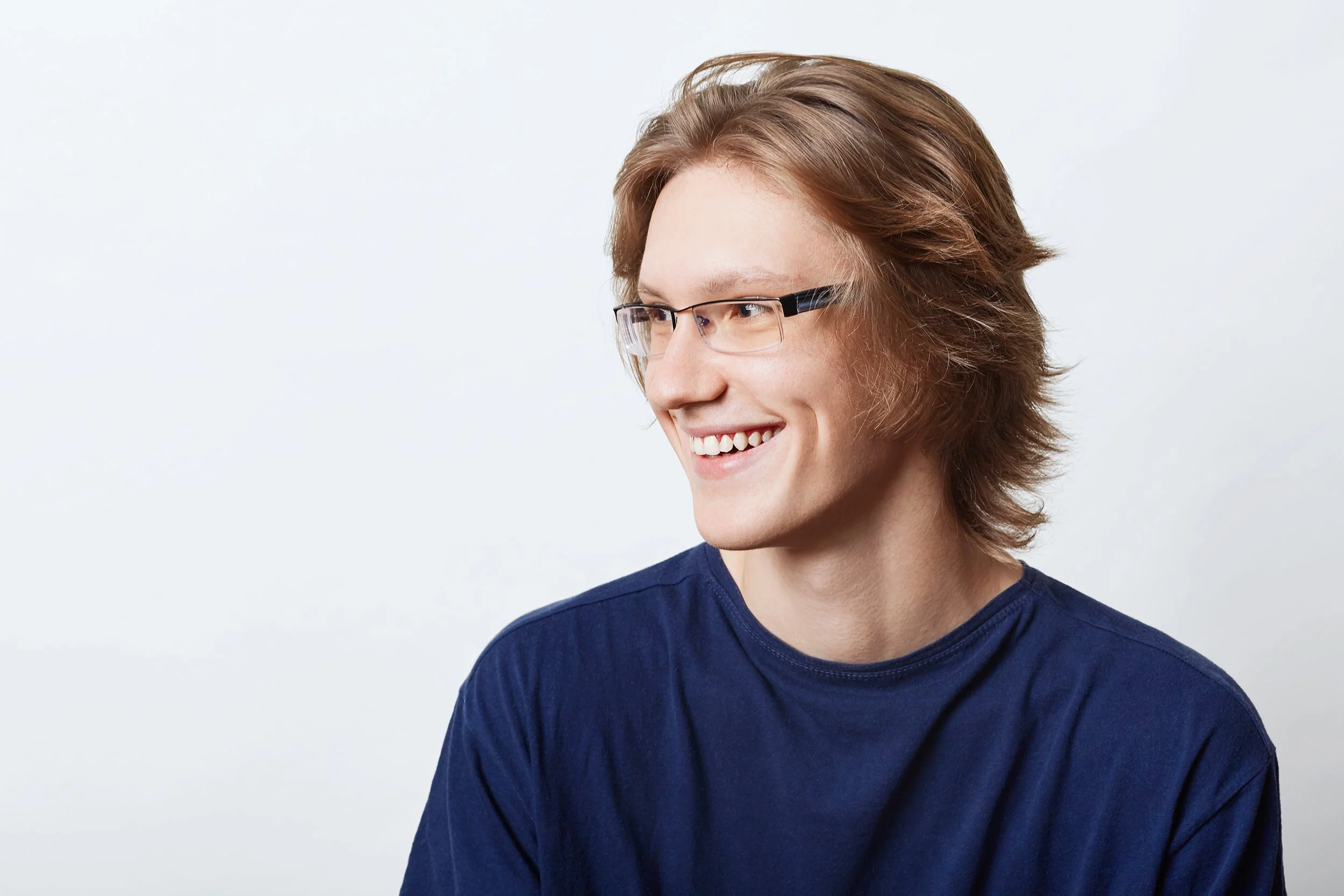 male-student-with-clever-expression-having-good-mood-smiling-pleasantly-while-rejoicing-his-success-exam-smiling-male-enterpreneur-casual-t-shirt-looking-aside-with-che.jpg