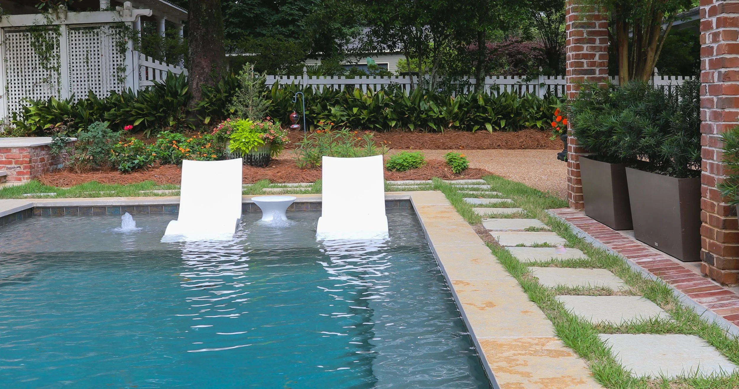 Why Every Custom Pool in South Alabama Needs a Sun Shelf This Summer