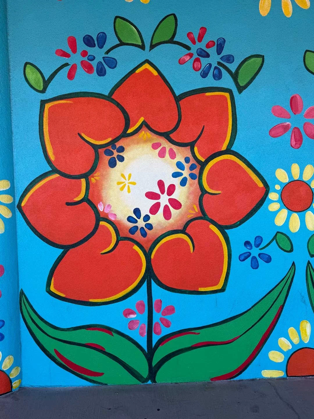 I picked up a cake in Albuquerque and noticed this cute flower mural made with heart shapes.