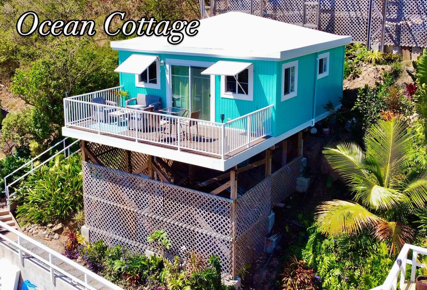 One of our two completed cottages. Ocean cottage. Beautiful blues and everything inside to remind you how gorgeous the ocean is here. Ocean view to hurricane hole and also to Lime out taco boat. KING bed air conditioning 55 inch TV beach chairs, snor
