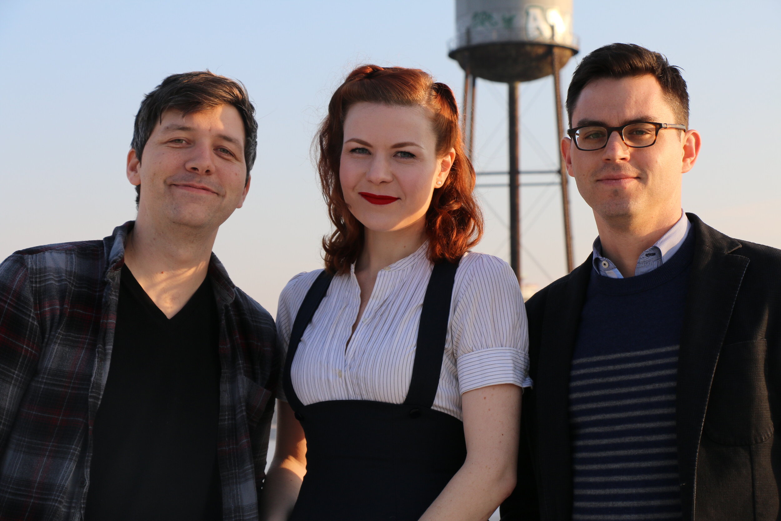 Image: Dylan Thuras, Ella Morton, and Joshua Foer stand outside on a sunny day, looking into the camera. Photo by Michelle Enemark.