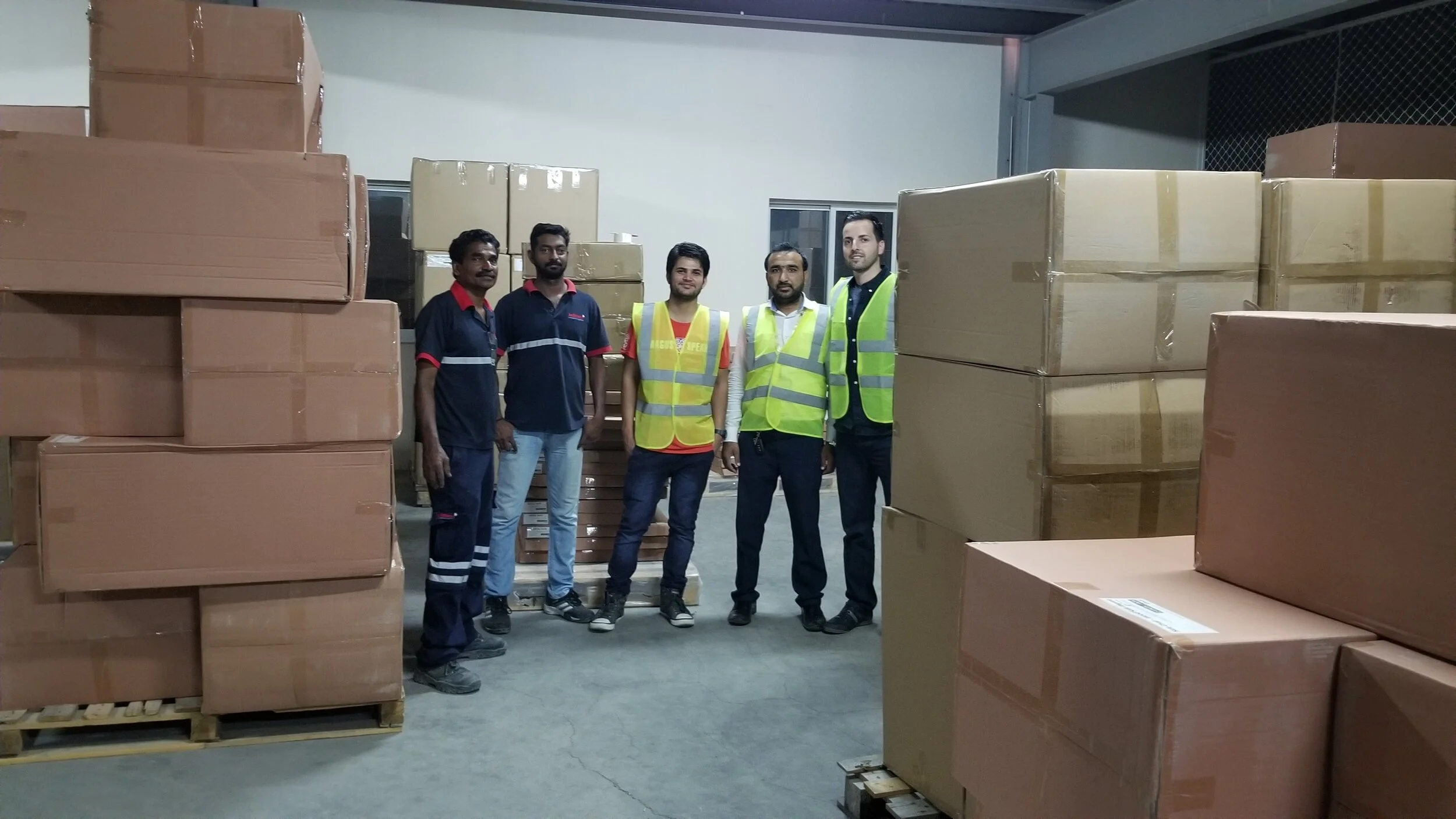 With the warehouse staff at the port of Abu Dhabi.