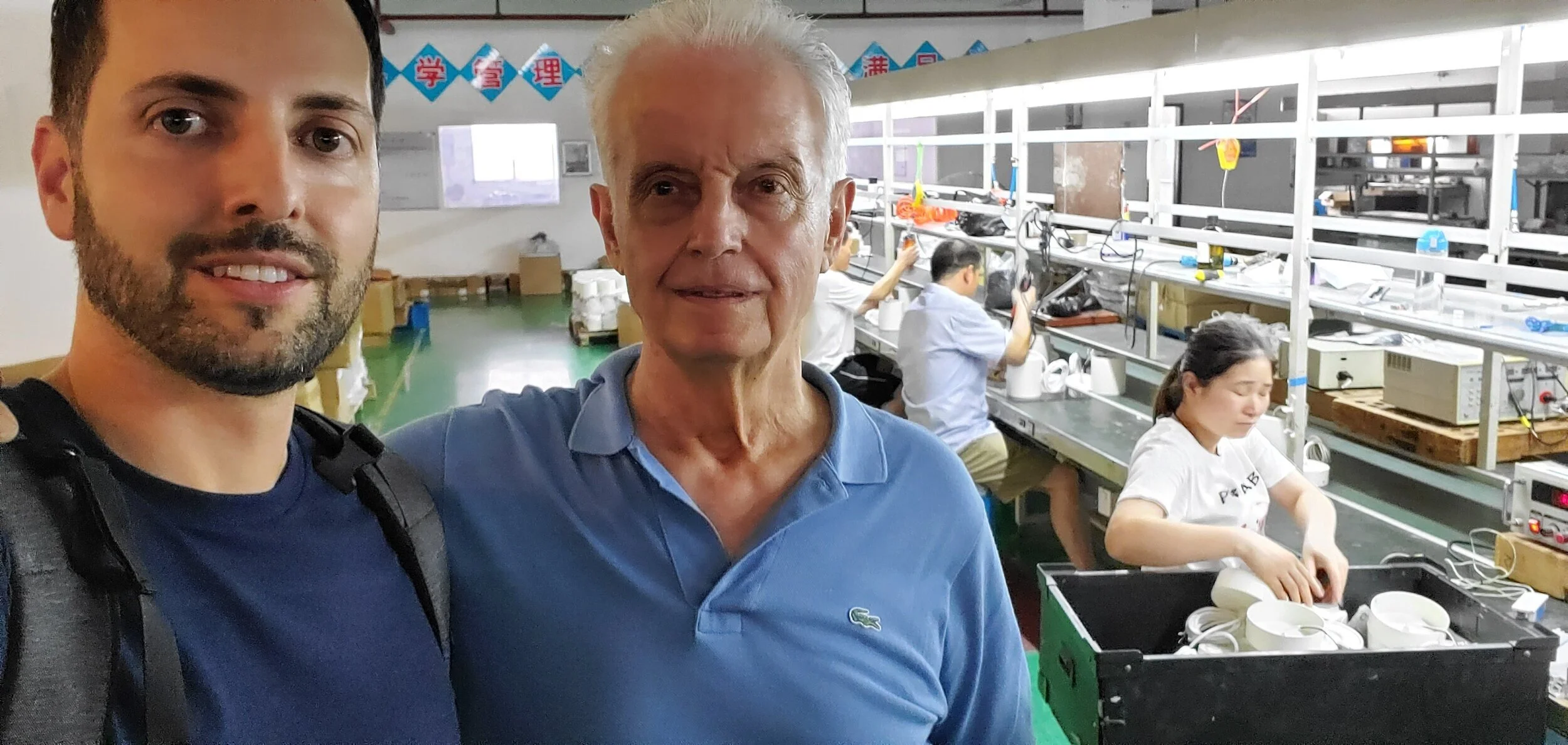 At my production facility in Shanghai, China showing my father, Angelo, around.