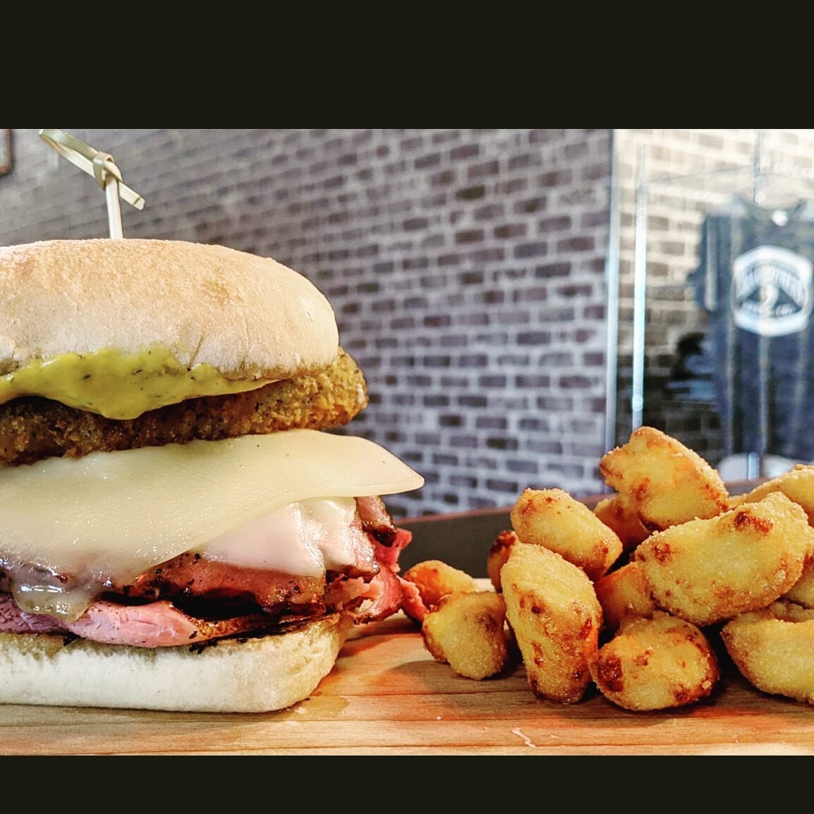 Have you tried @braubeer Cubano Sandwich?! Ciabatta bread filled with our ham and Canadian bacon, dill mustard, swiss cheese and fried pickles. Pair it with some cheese curds and a Thresher. 🍺