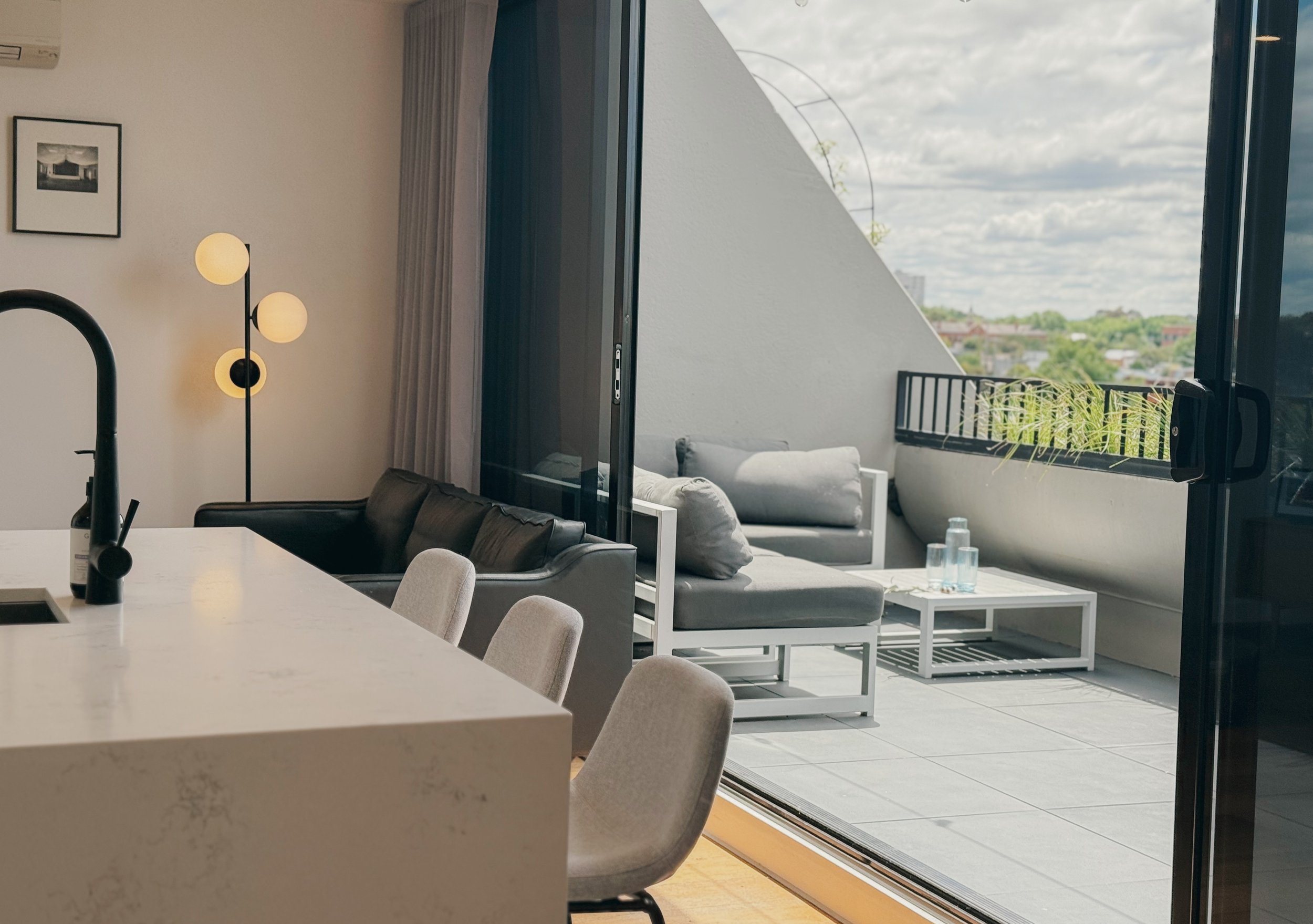 Dining area opening to terrace in Collingwood 2-bedroom Airbnb apartment