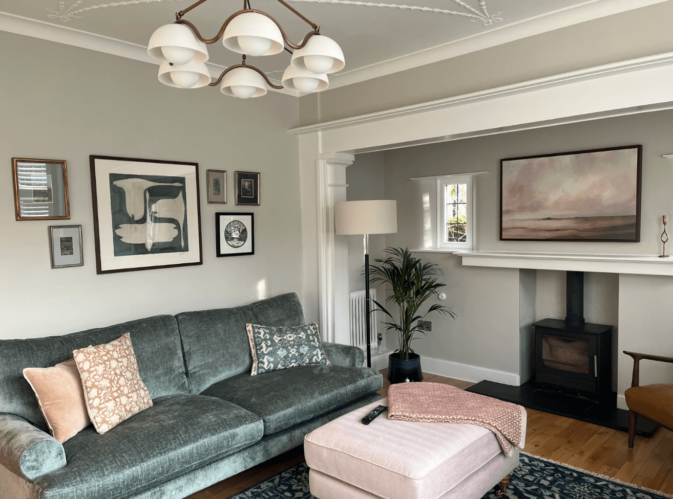Living room designed by The Living House, sofa, gallery wall, rug and feature fireplace
