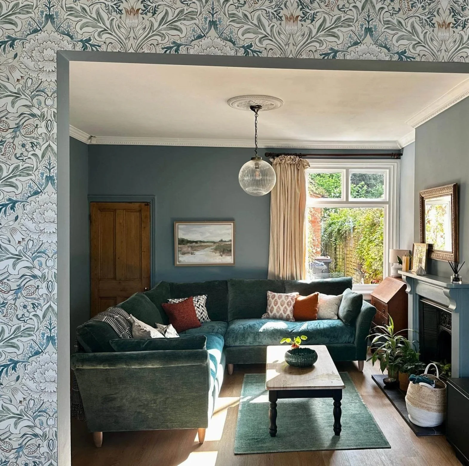 Traditional blue living room with William Morris wallpape