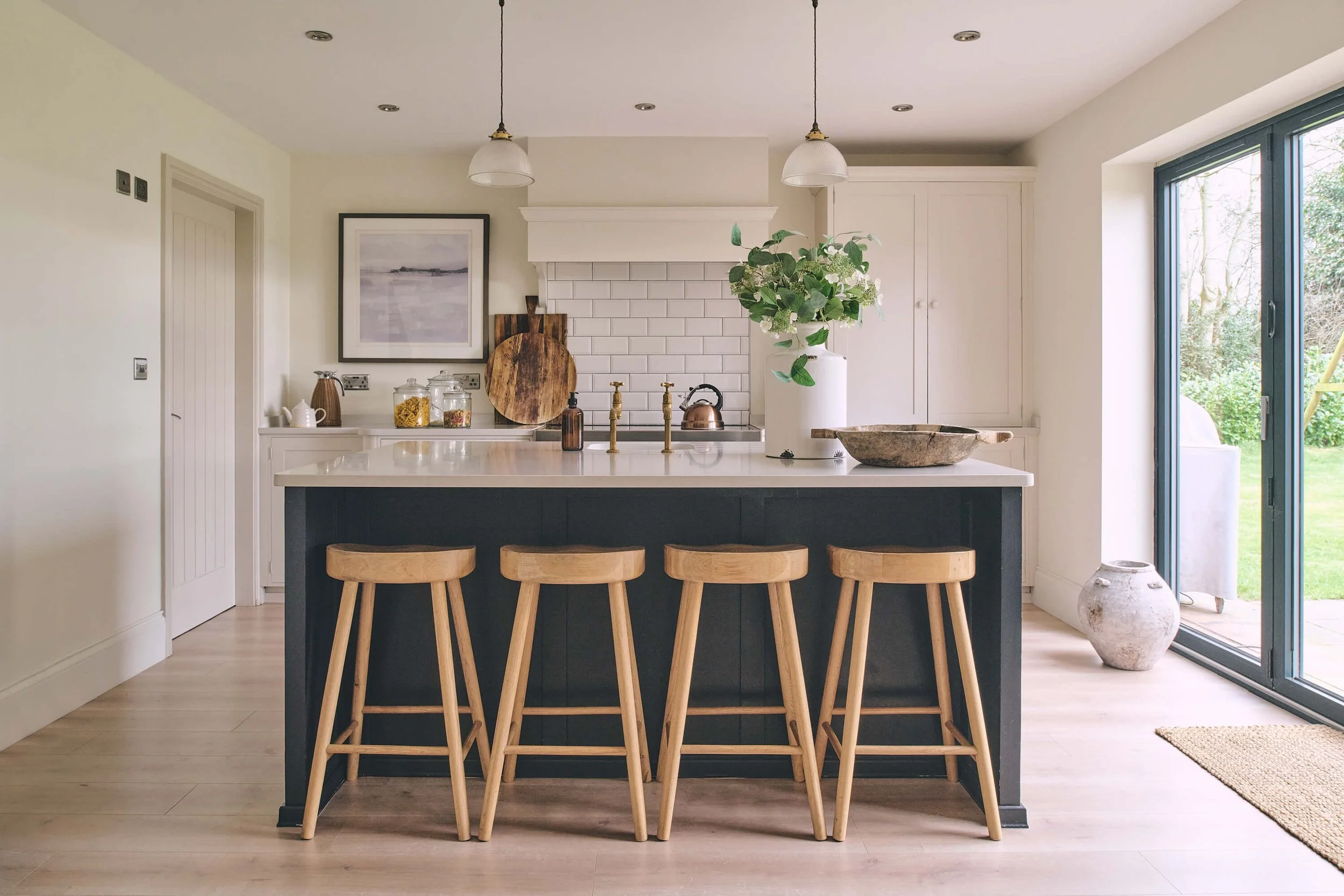 Neutral kitchen with dark island