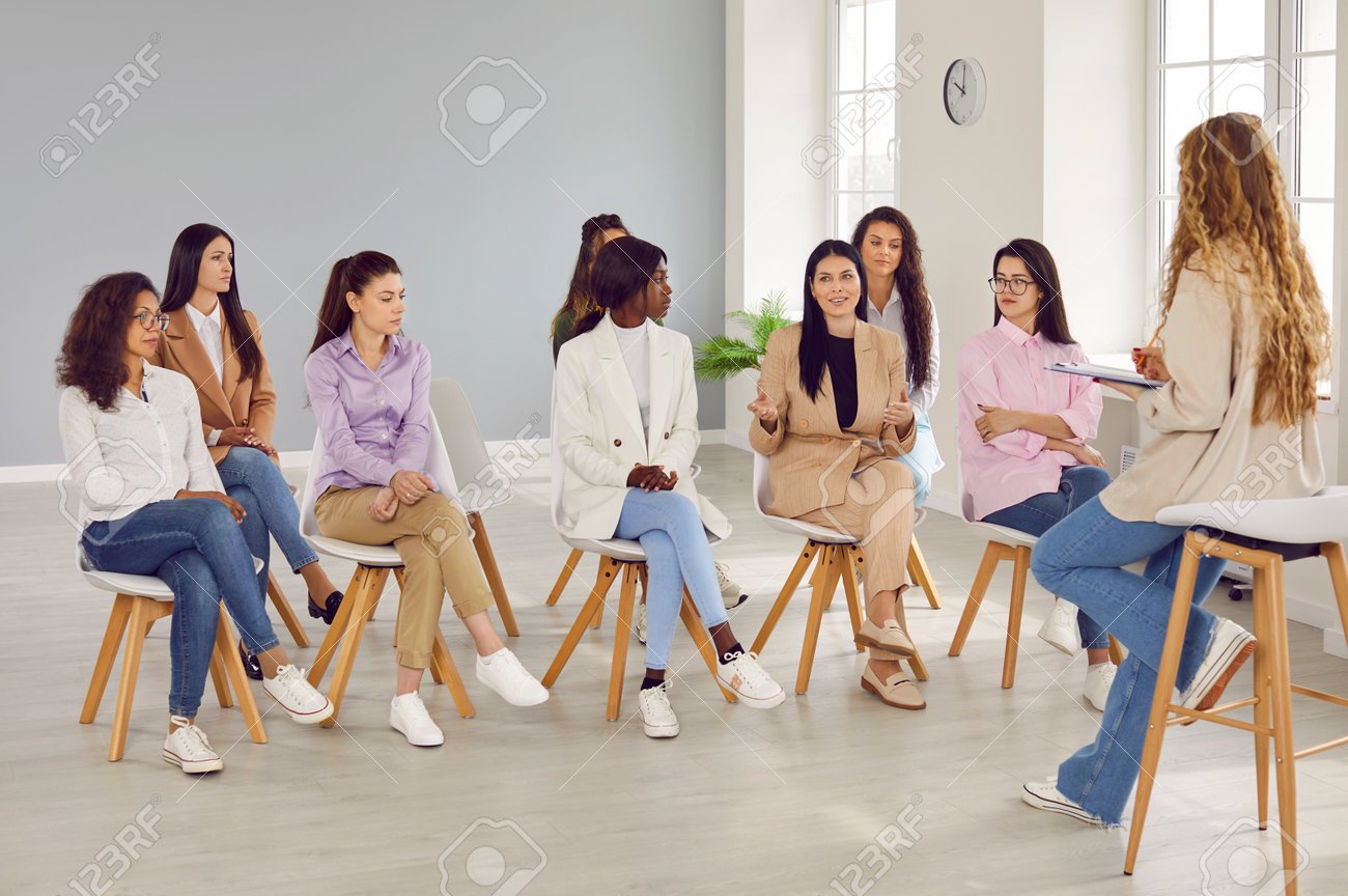 204372456-group-of-young-diverse-women-having-discussion-during-a-business-workshop-with-a-professional-coach.jpg